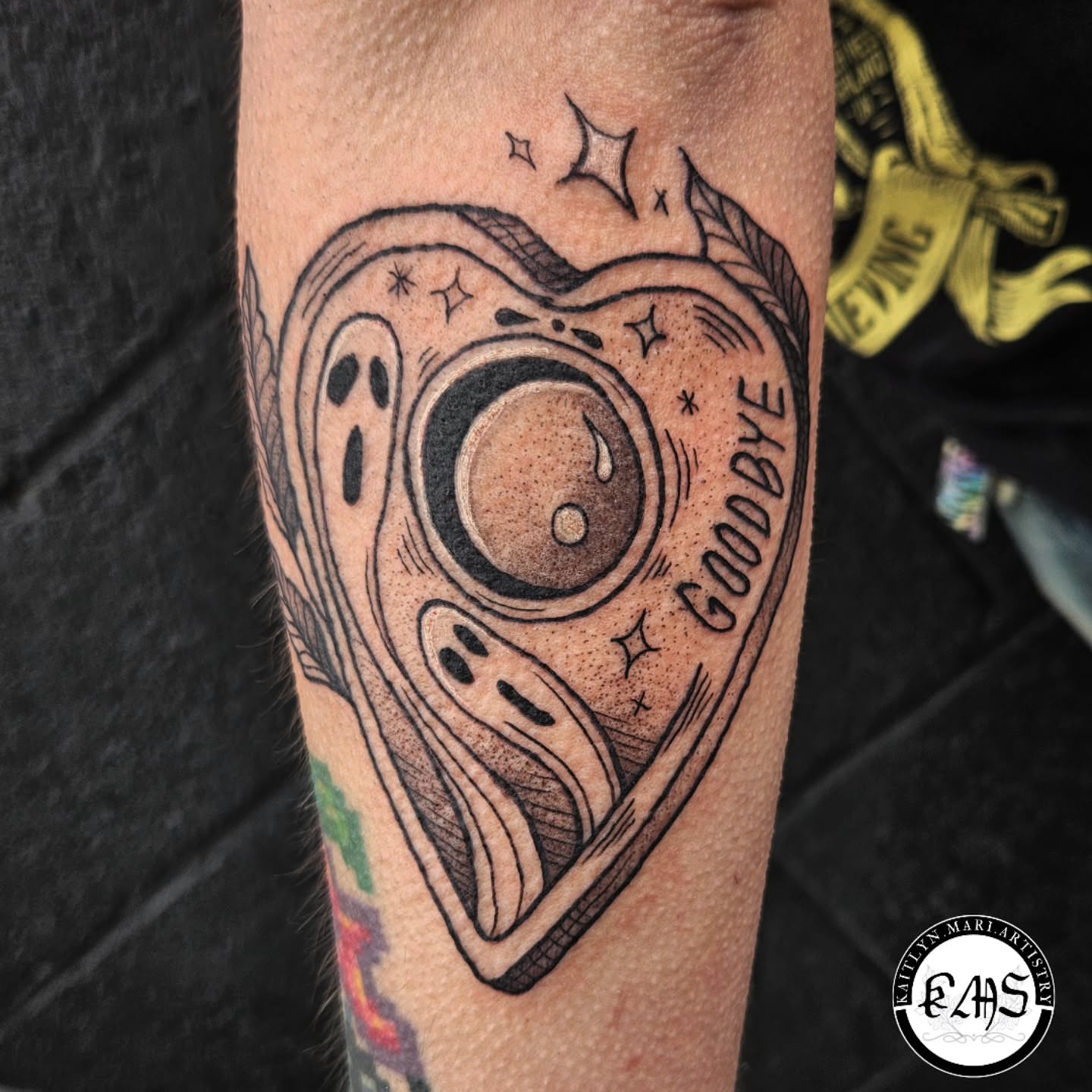 Heart with ghost and moon dotwork tattoo on the forearm by Kaitlyn Marianna Skewes 🌙 Illustrative