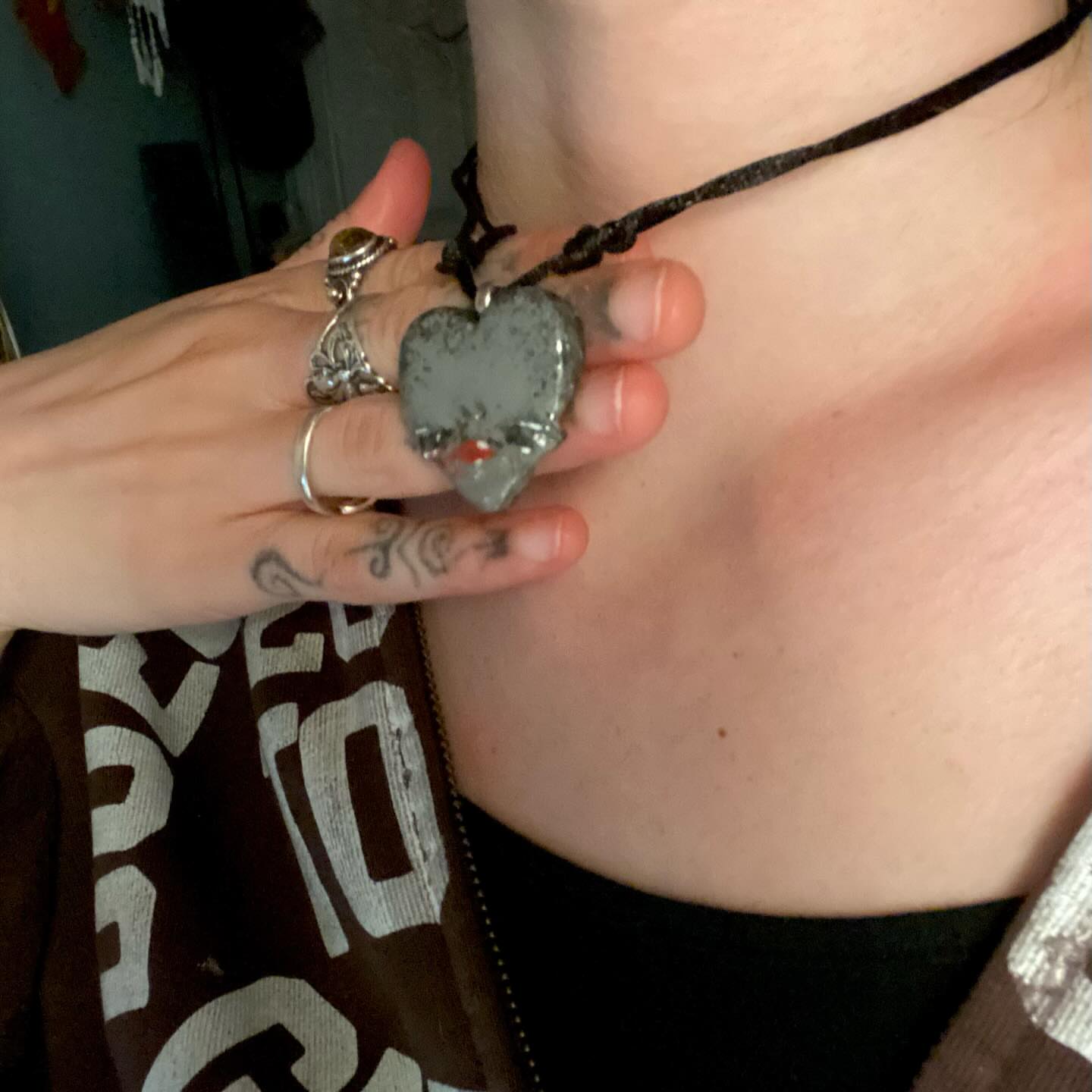 Heart black and grey tattoo on the chest by Jesikah Rapp
