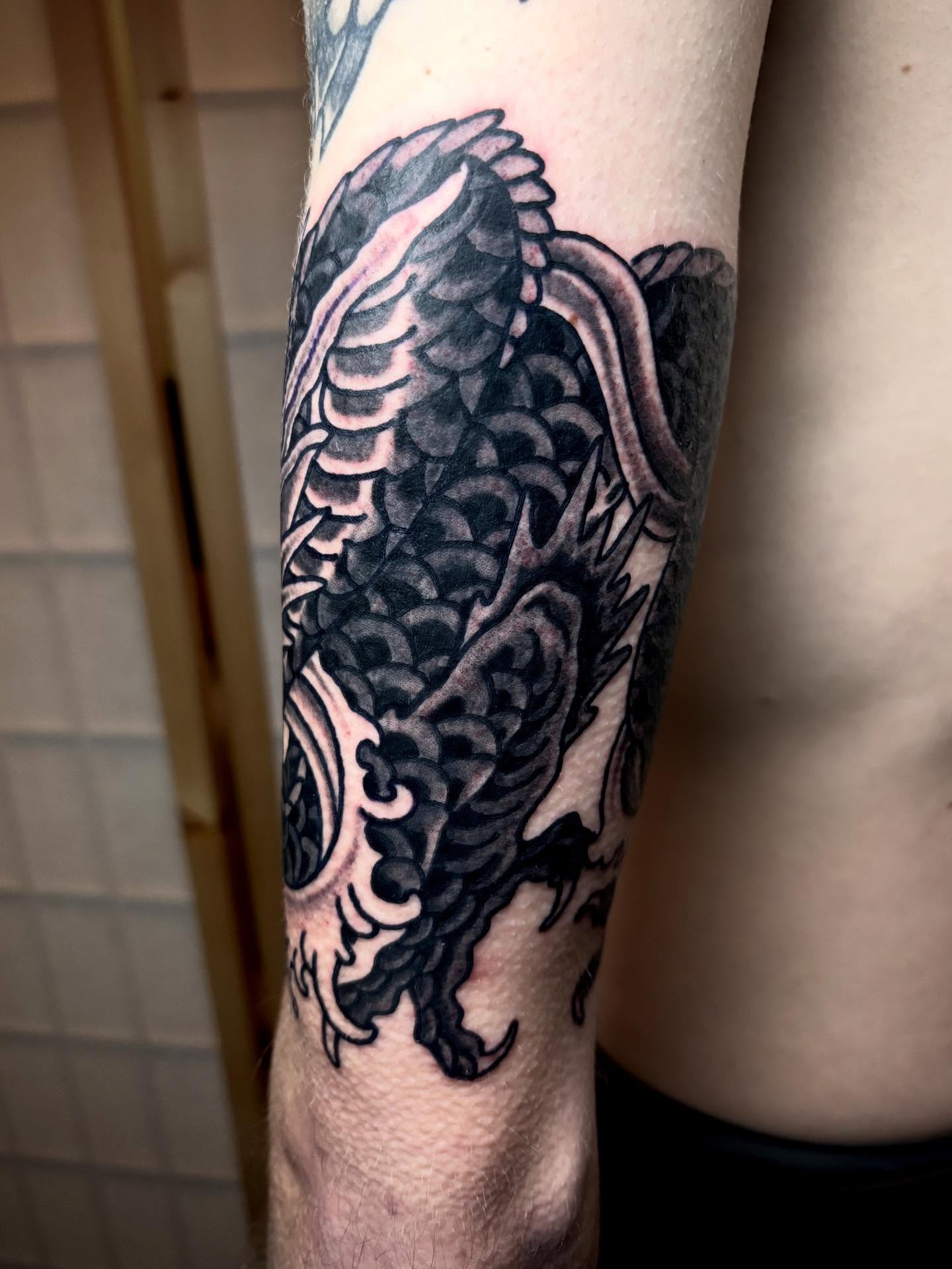 Koi fish black and grey tattoo on the forearm by ๐๐ซ๐ข๐ ๐๐ฅ๐ญ๐จ๐ง๐๐ง