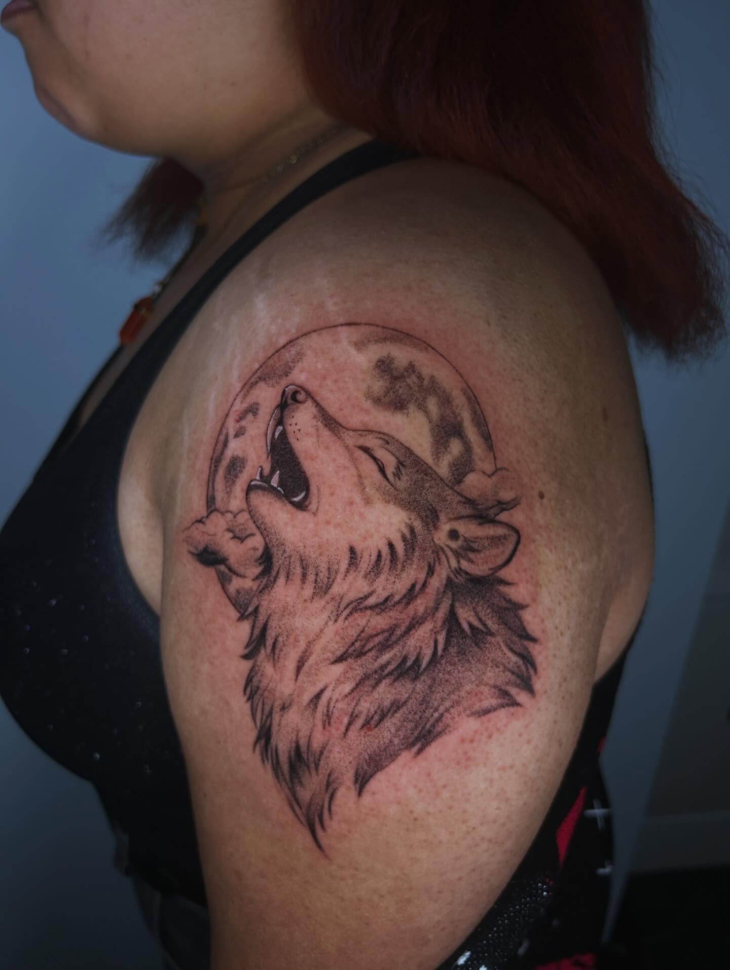 Wolf howling at moon realism tattoo on the shoulder by J