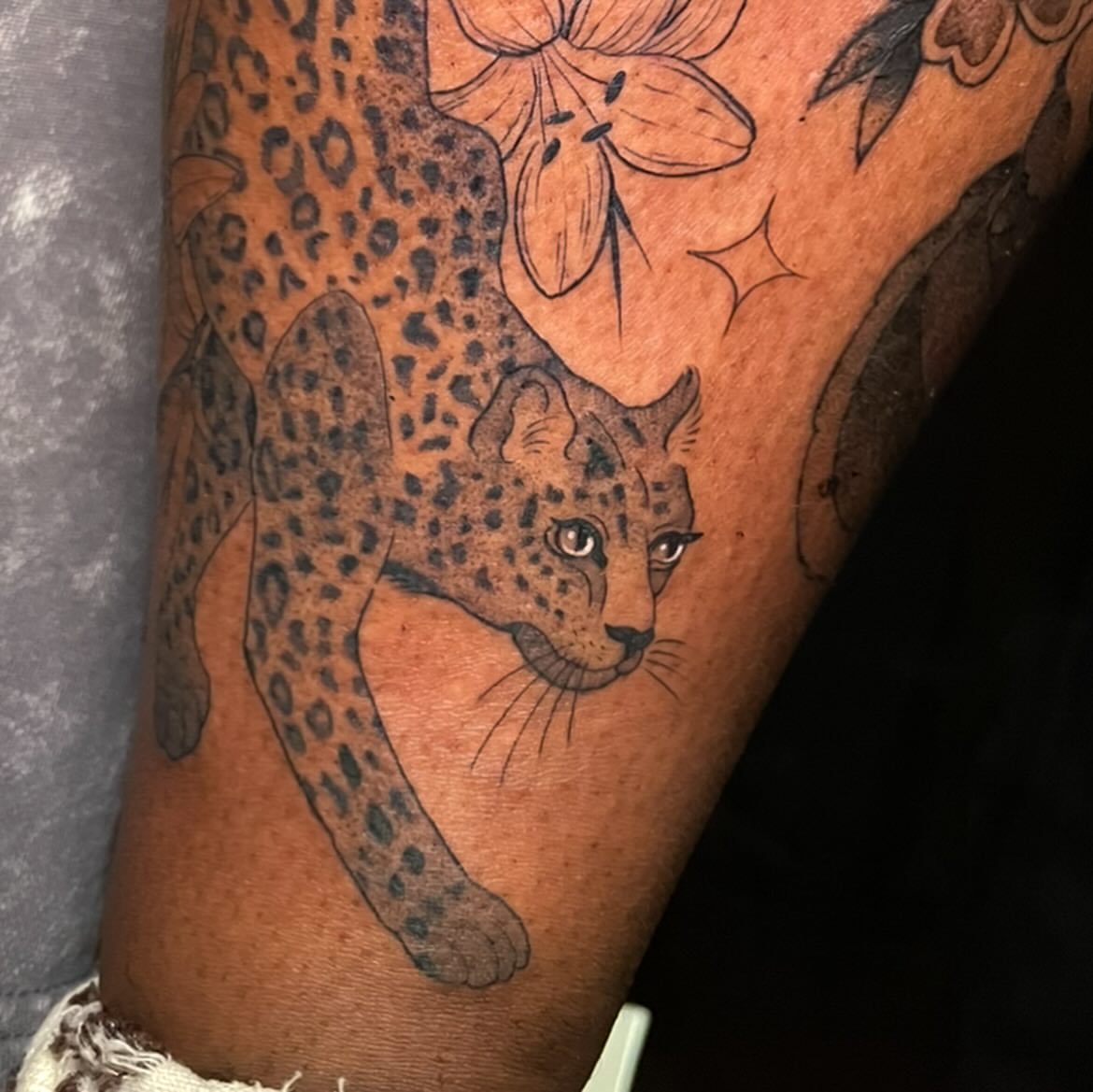 Leopard realism tattoo on the forearm by Reagan Mauldin