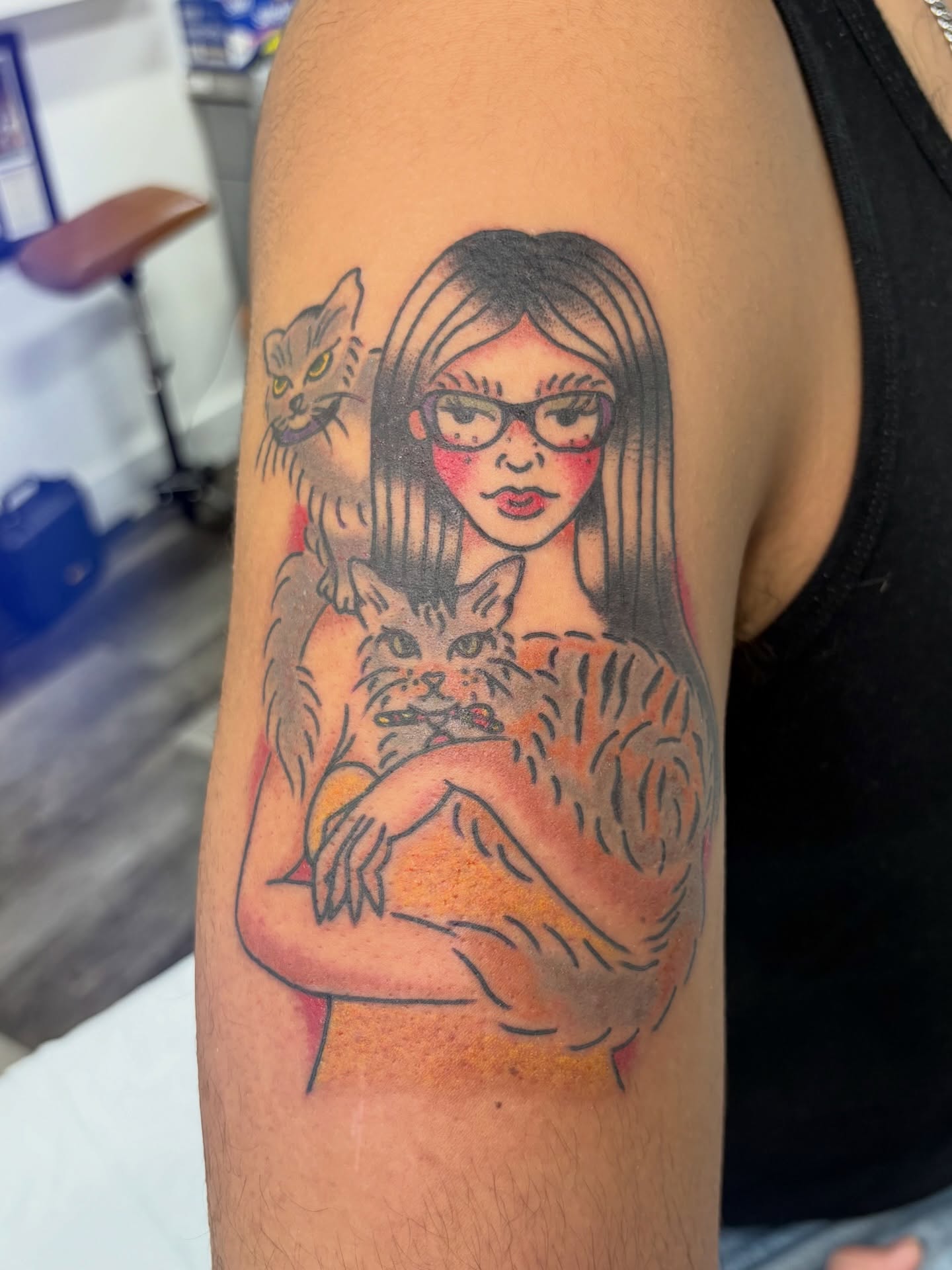 Woman with cats realism tattoo on the upper arm by Aysia Mankin-Wong, San Francisco, California