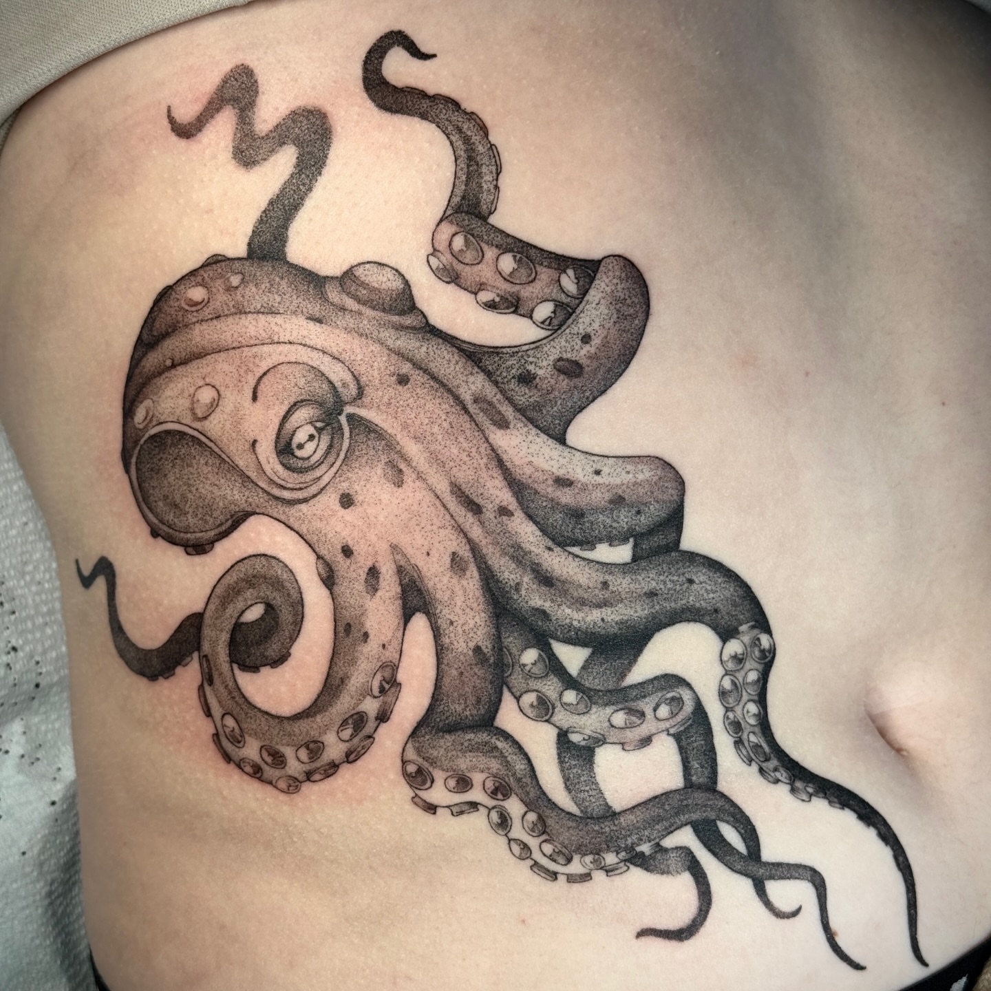 Octopus dotwork tattoo on the chest by Molly Murray