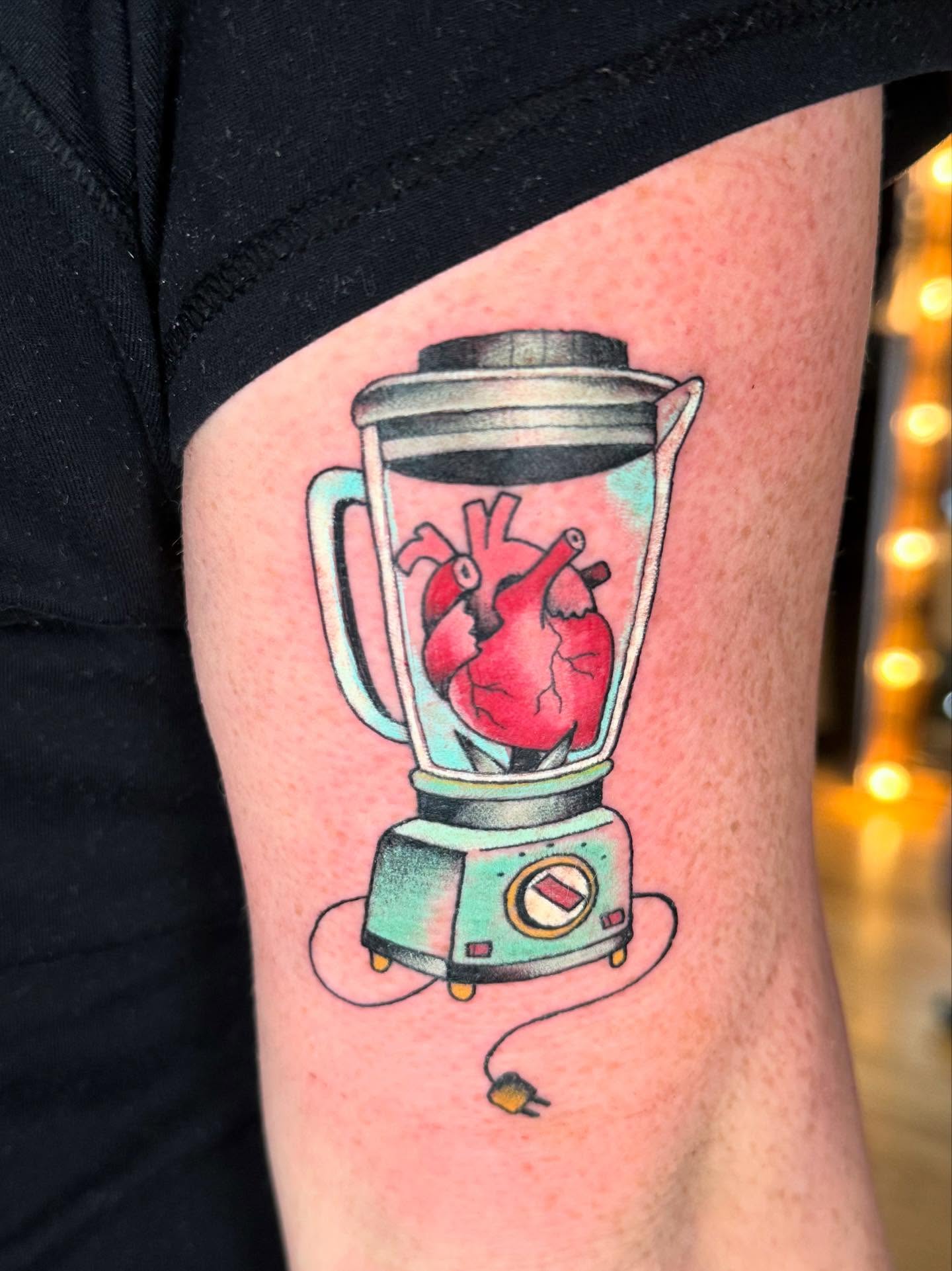 Blender with heart realism tattoo on the forearm by Katy Bisby