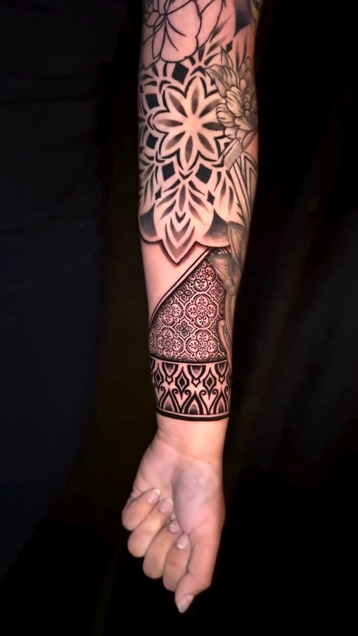 Mandala and geometric patterns geometric tattoo on the forearm by Ivy lee