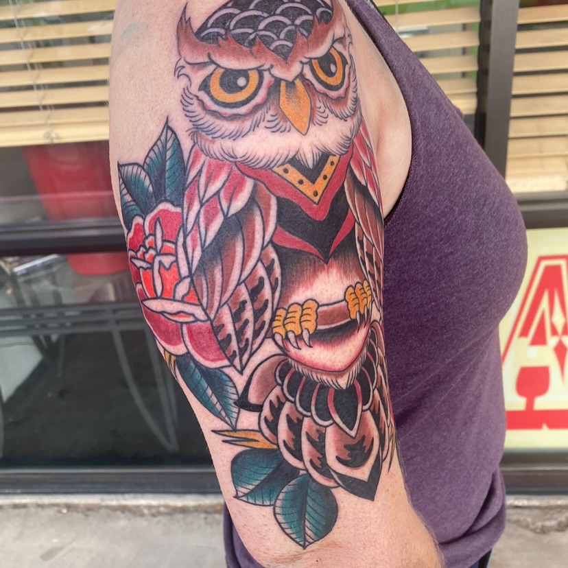 Owl and roses American traditional tattoo on the forearm by Nick Weaver