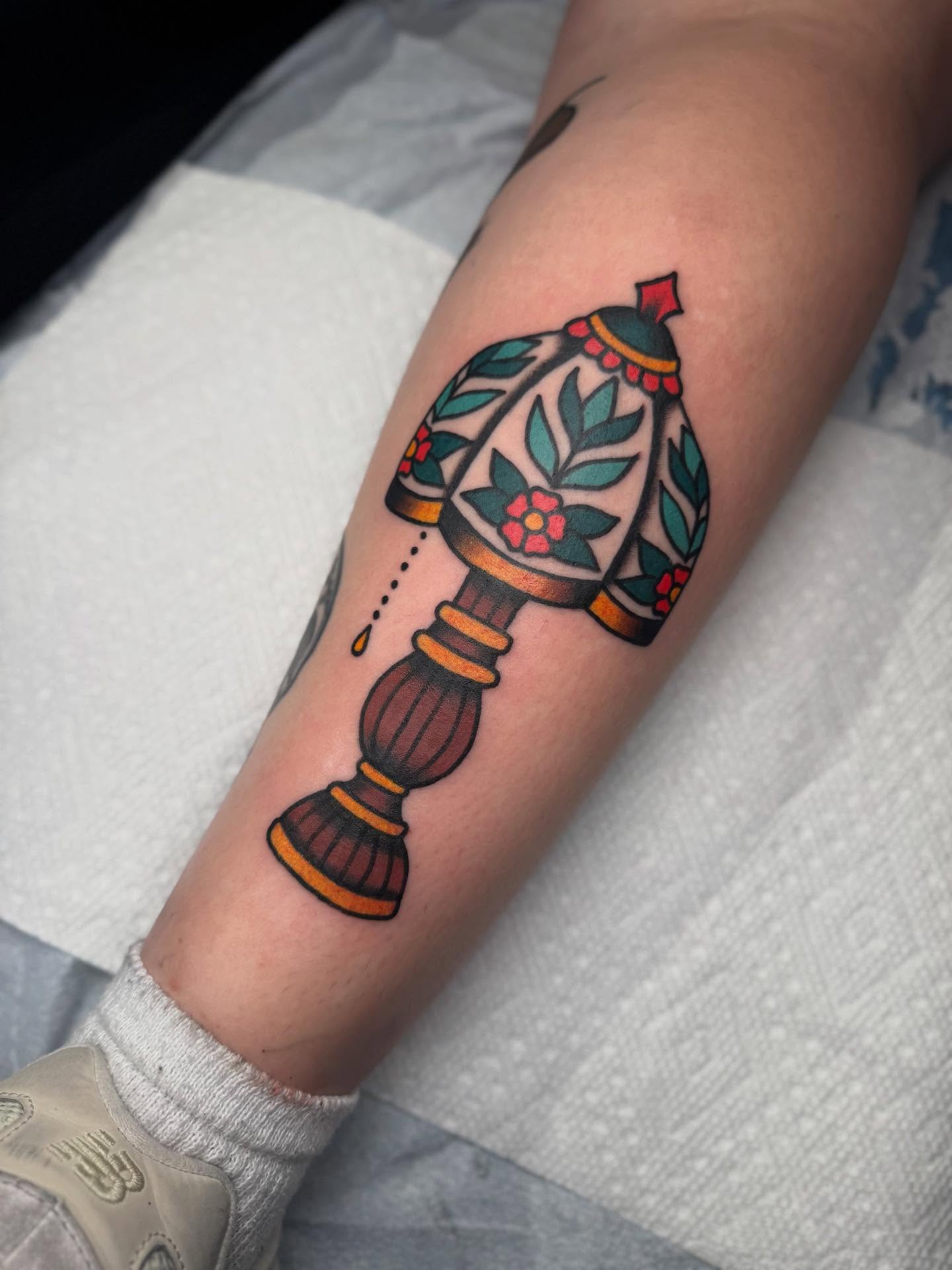 Lamp American traditional tattoo on the forearm by Elle Yax