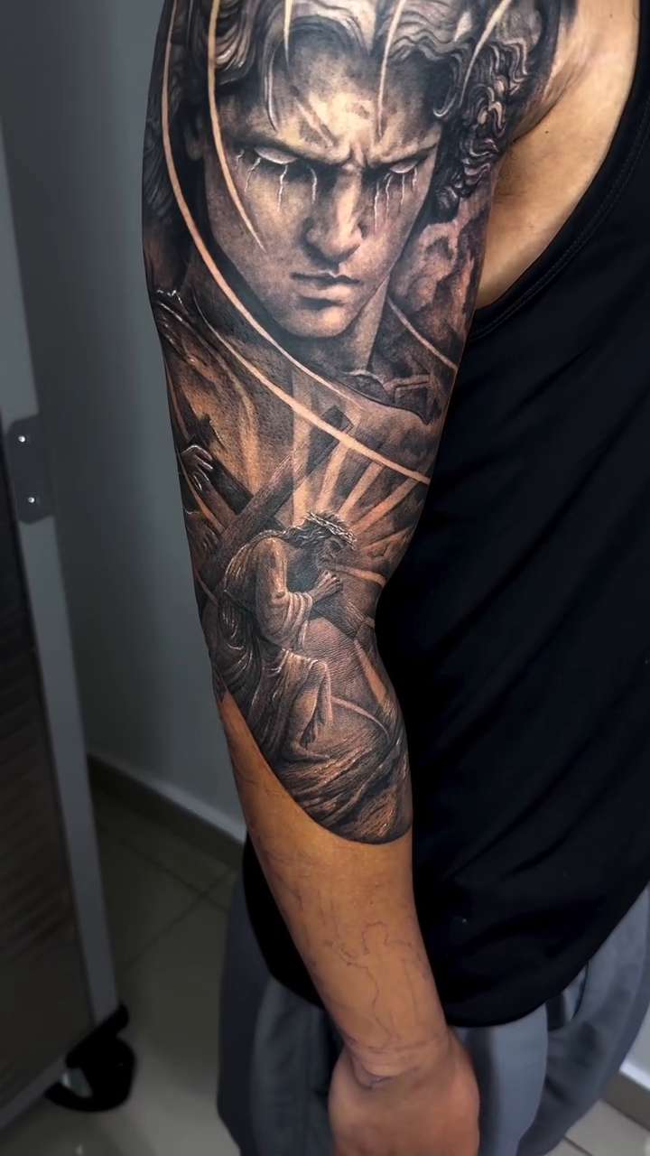 Tattoo by @elmertattoo1 — realism, black_and_grey