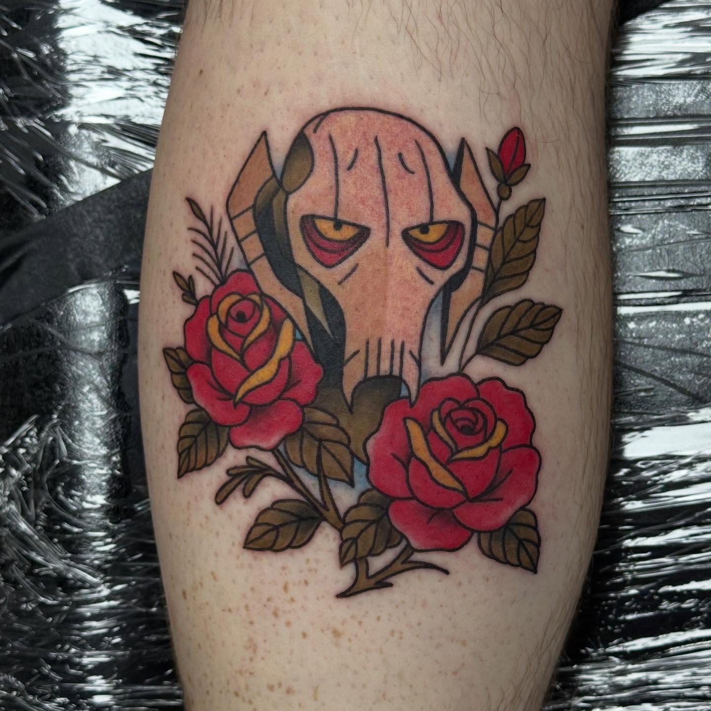 Robotic head with roses geometric tattoo on the forearm by Olivia Norbert
