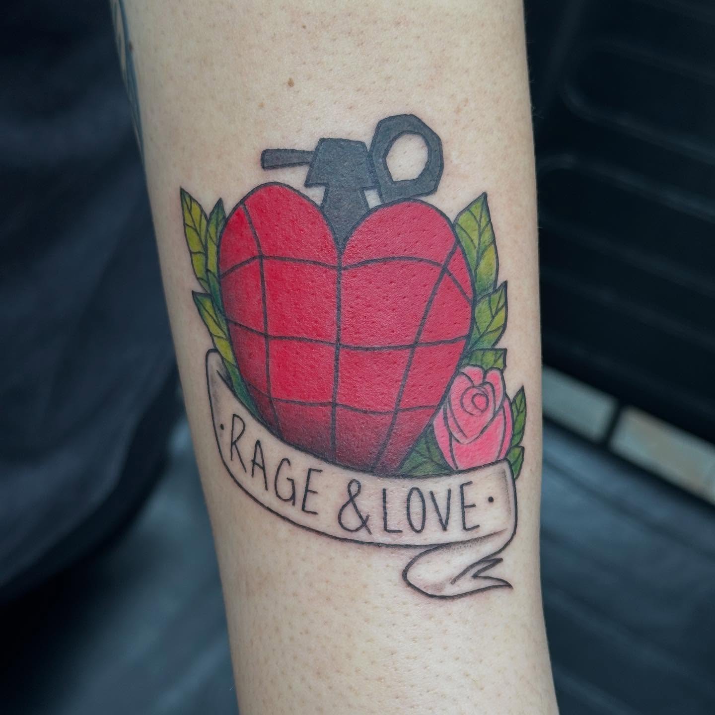 Heart grenade American traditional tattoo on the forearm by Olivia Norbert