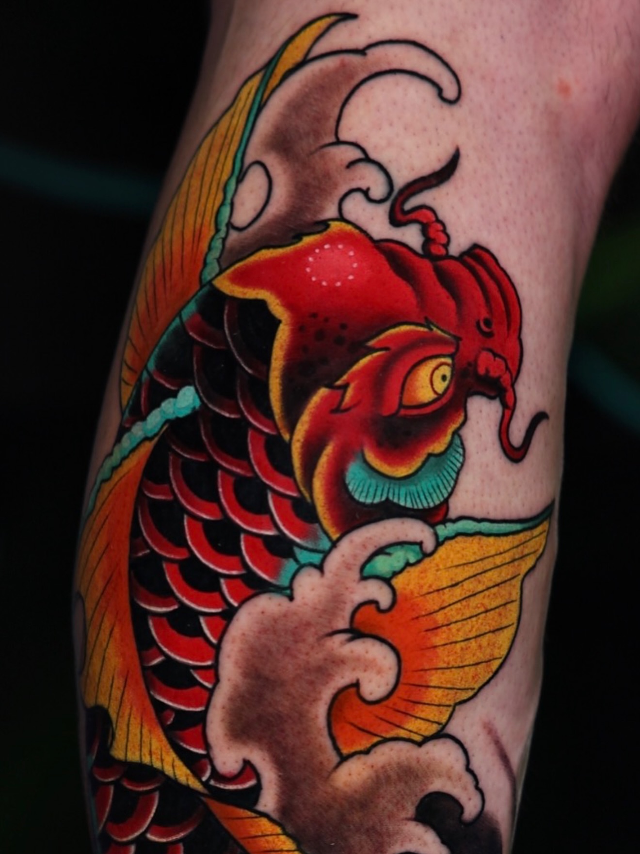 Koi fish American traditional tattoo on the forearm by Drex - Dallas Tattoo Artist