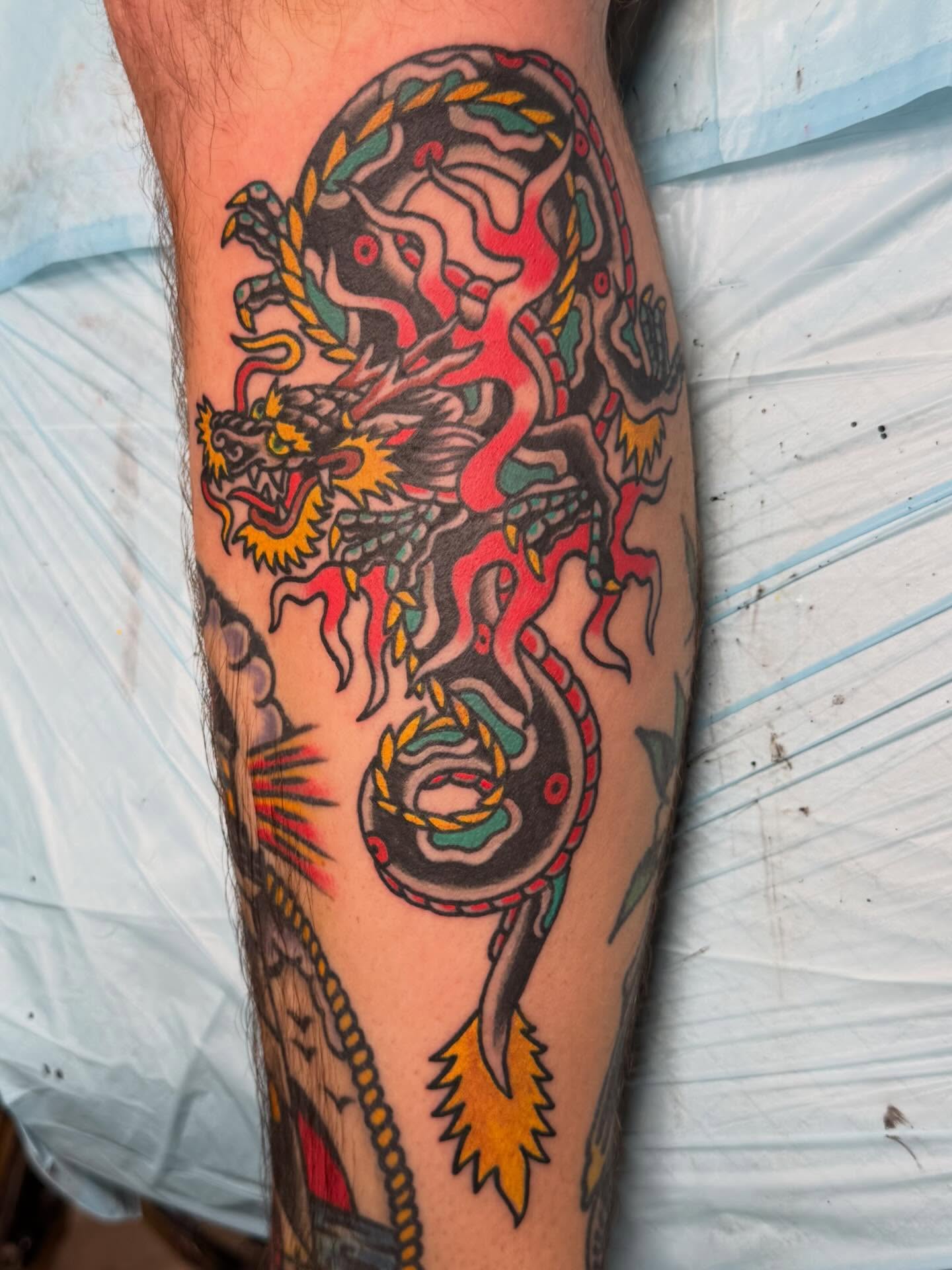 Dragon American traditional tattoo on the forearm by Bill Crawford, Plymouth, Michigan