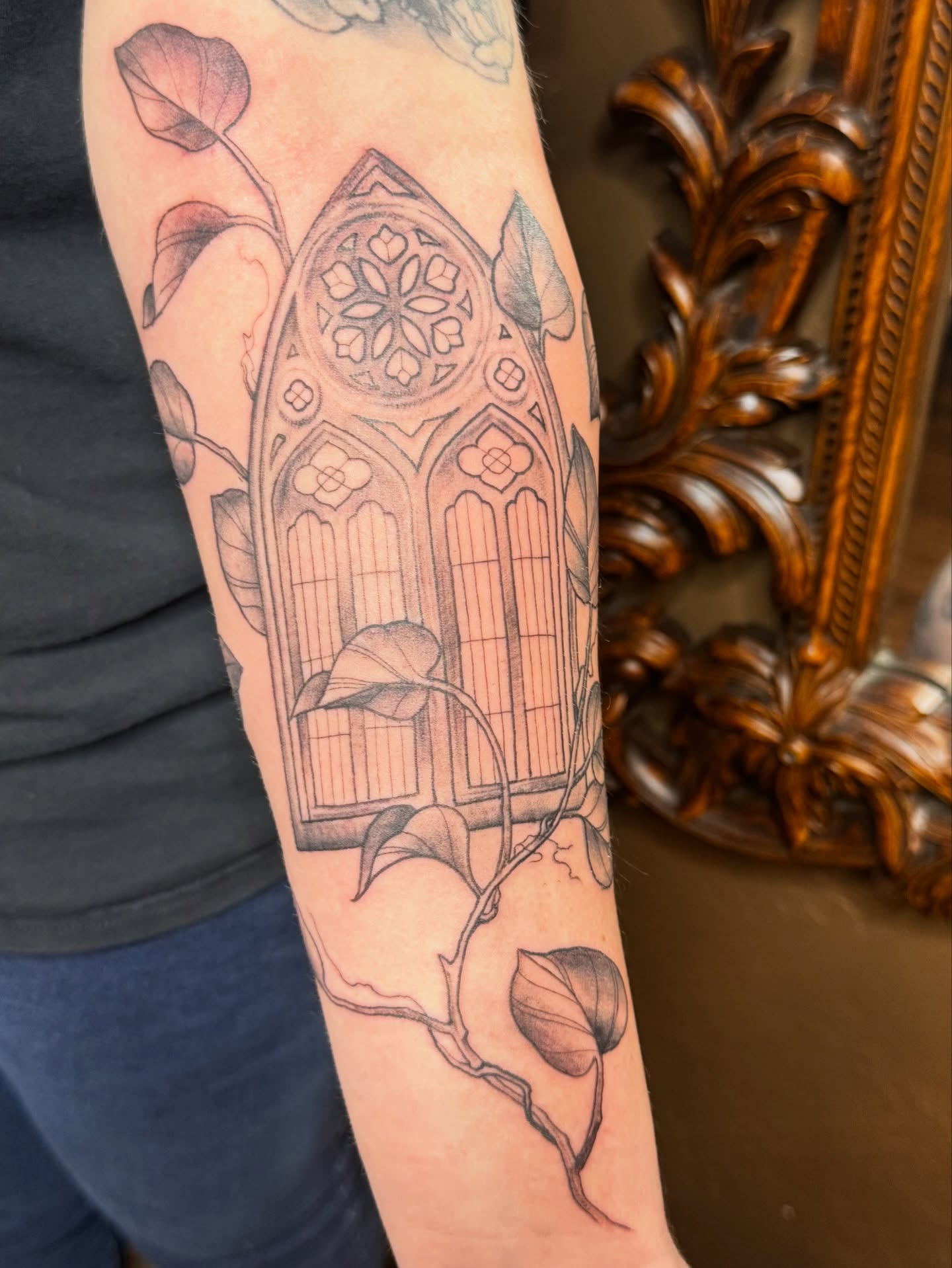 Gothic window black and grey tattoo on the forearm by Teagan Rachel, Millcreek, Utah