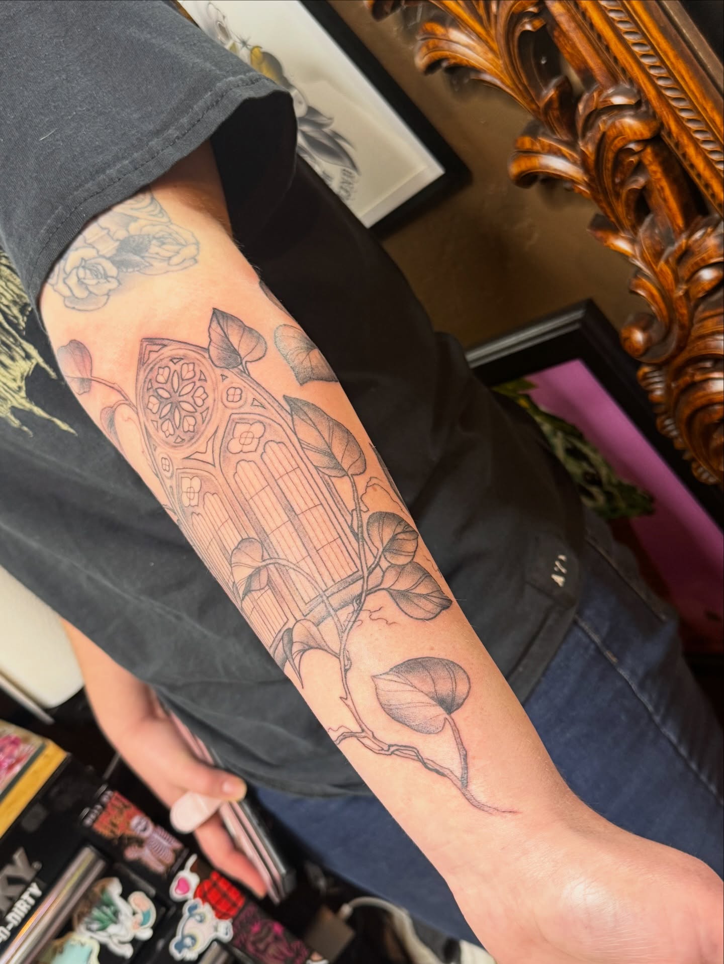 Gothic window and floral geometric tattoo on the forearm by Teagan Rachel, Millcreek, Utah