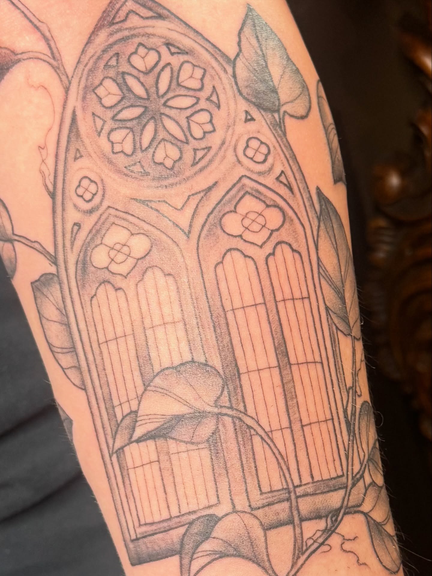 Gothic window black and grey tattoo on the forearm by Teagan Rachel, Millcreek, Utah