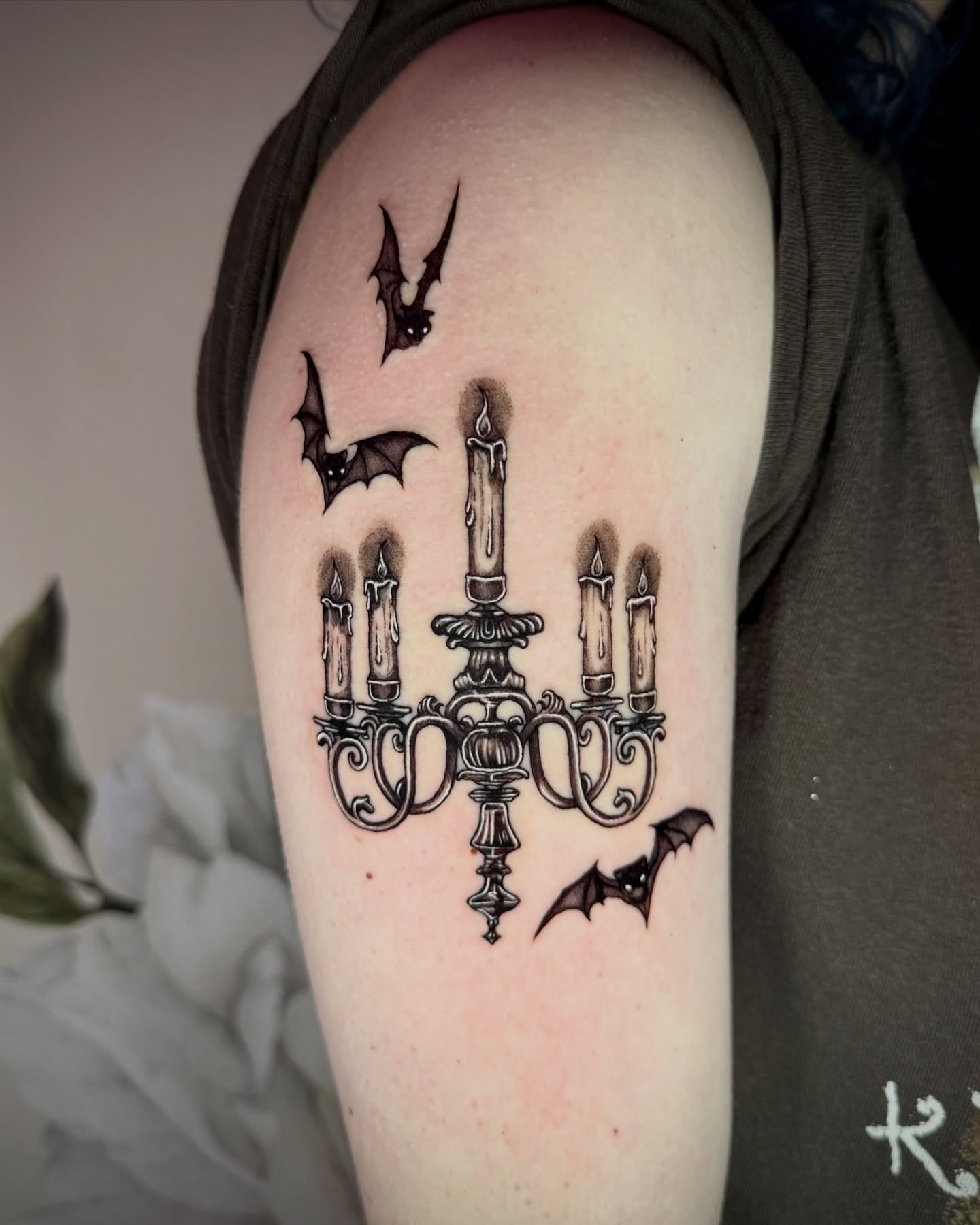 Candelabra with bats dark realism tattoo on the forearm by Emily‹𝟹