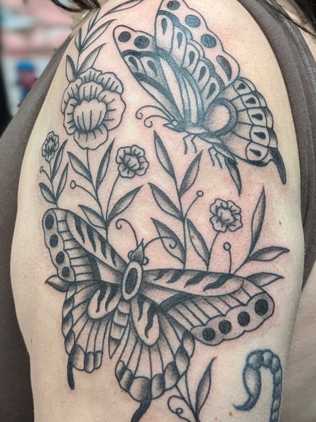 Butterflies and flowers American traditional tattoo on the shoulder by Alexandria Green