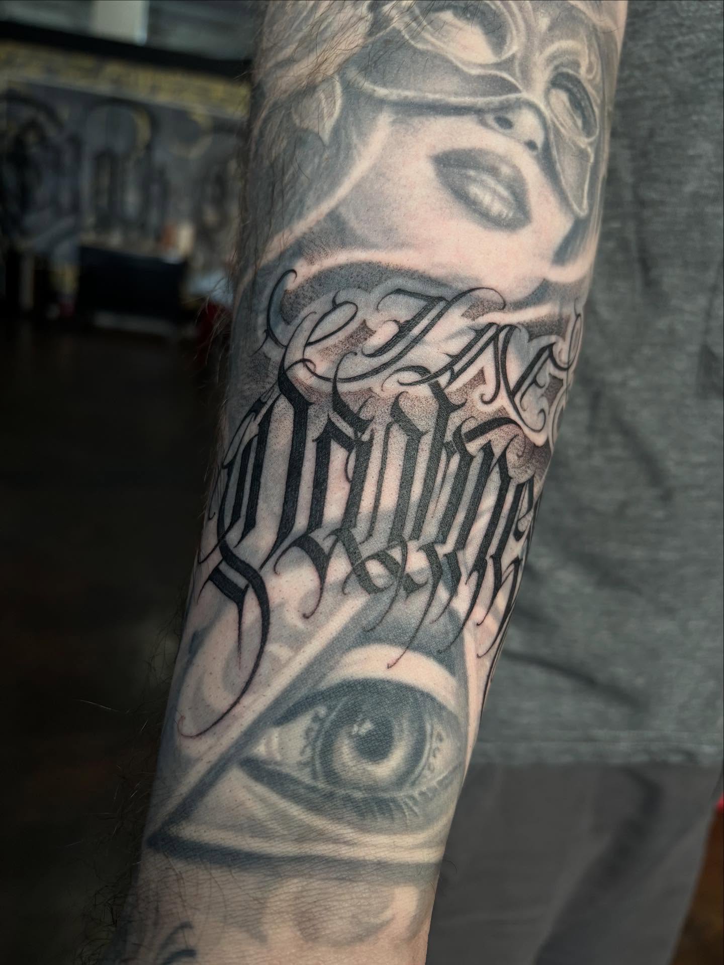 Eye and script realism tattoo on the forearm by Ashley brown, Las Vegas, Nevada