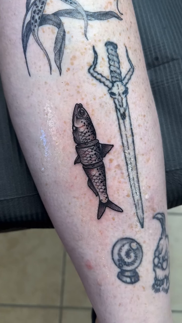 Shark and sword blackwork tattoo by K9