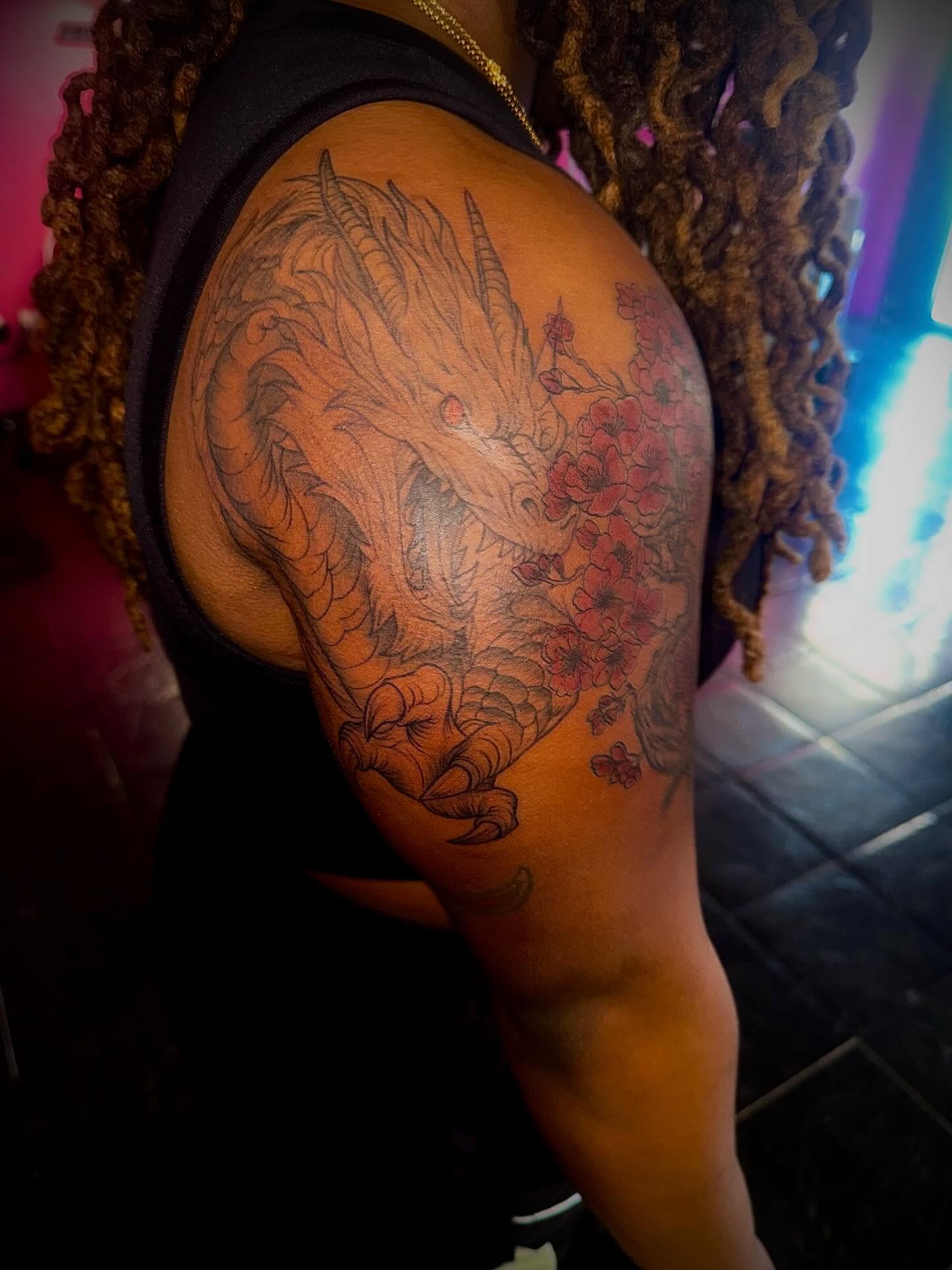Dragon and cherry blossoms japanese irezumi tattoo on the shoulder by Clifford Jordan