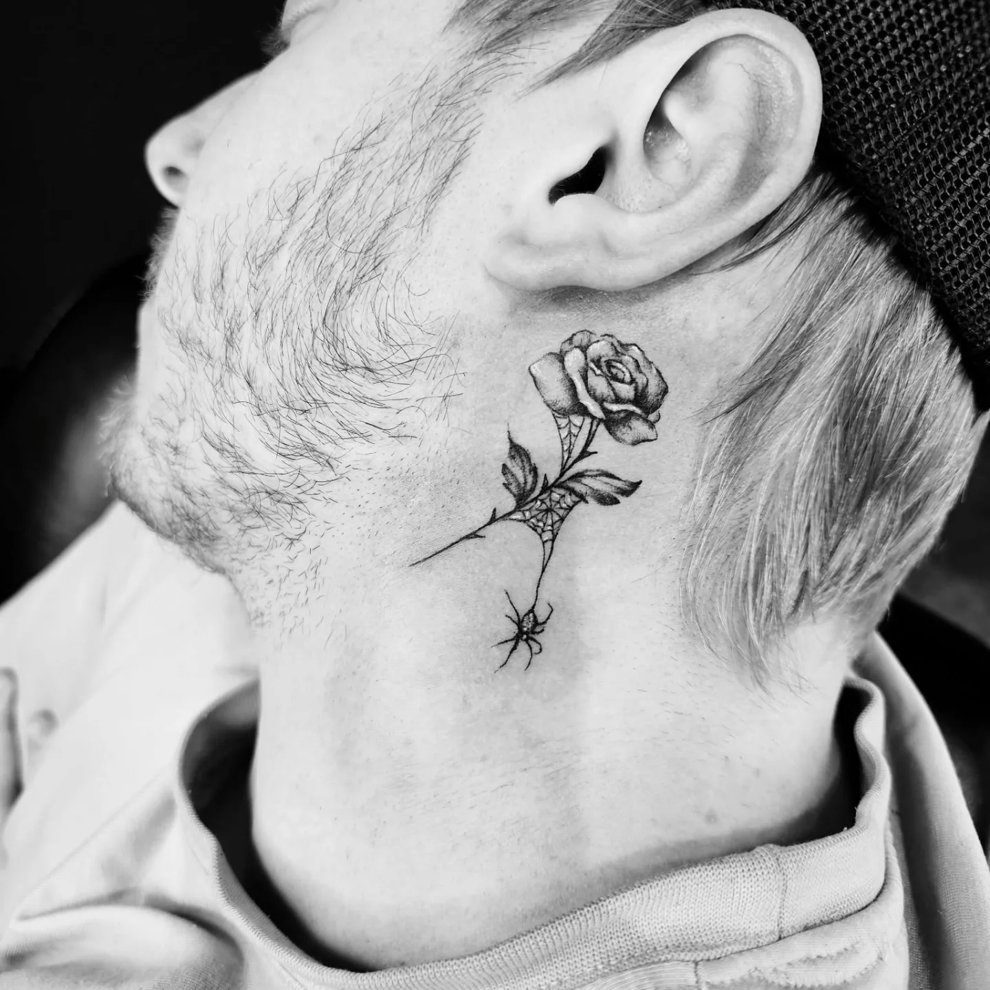 Rose and spider realism tattoo on the neck by Drew King
