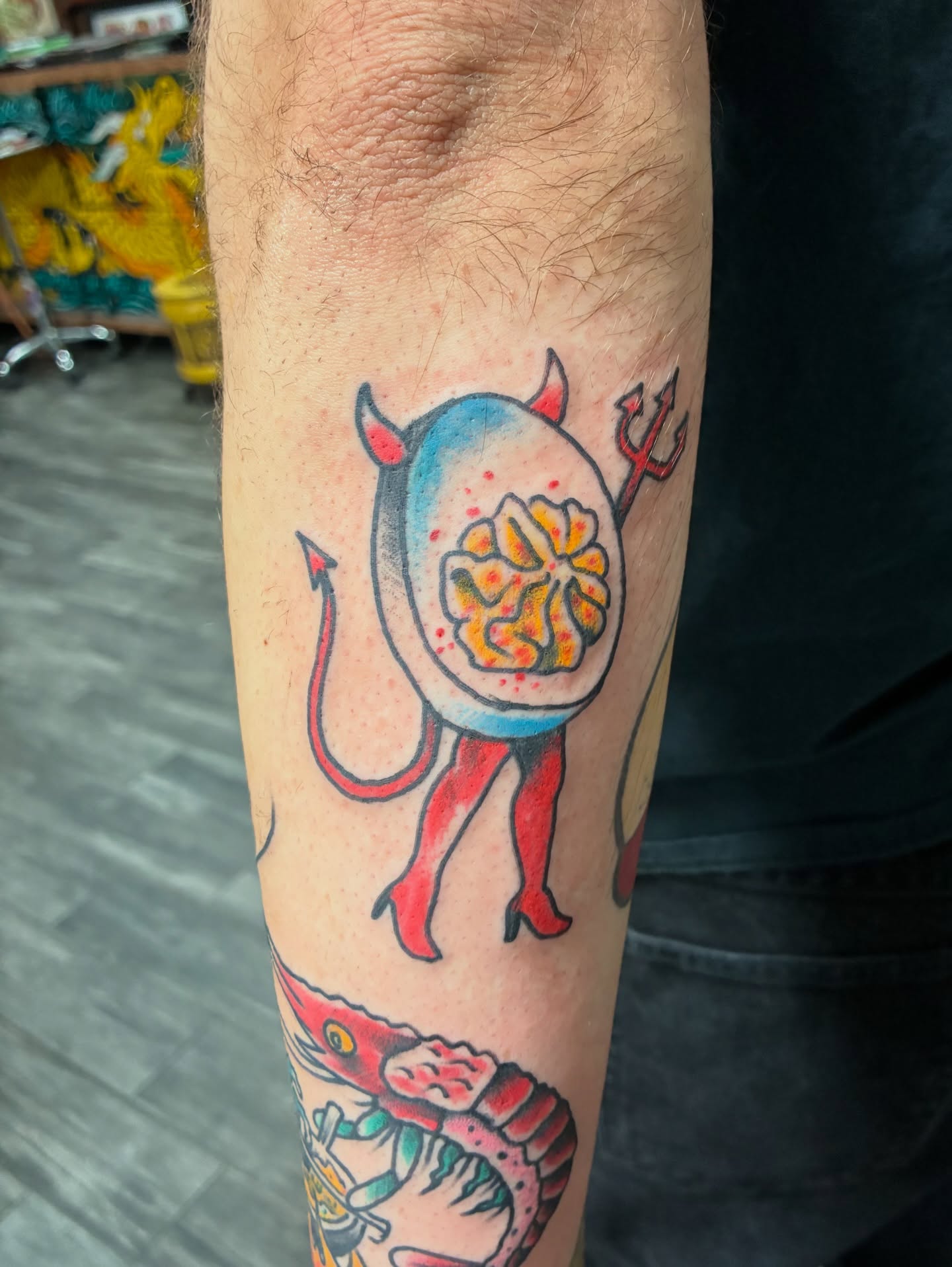 Floral devil American traditional tattoo on the forearm by Kennedy Cole