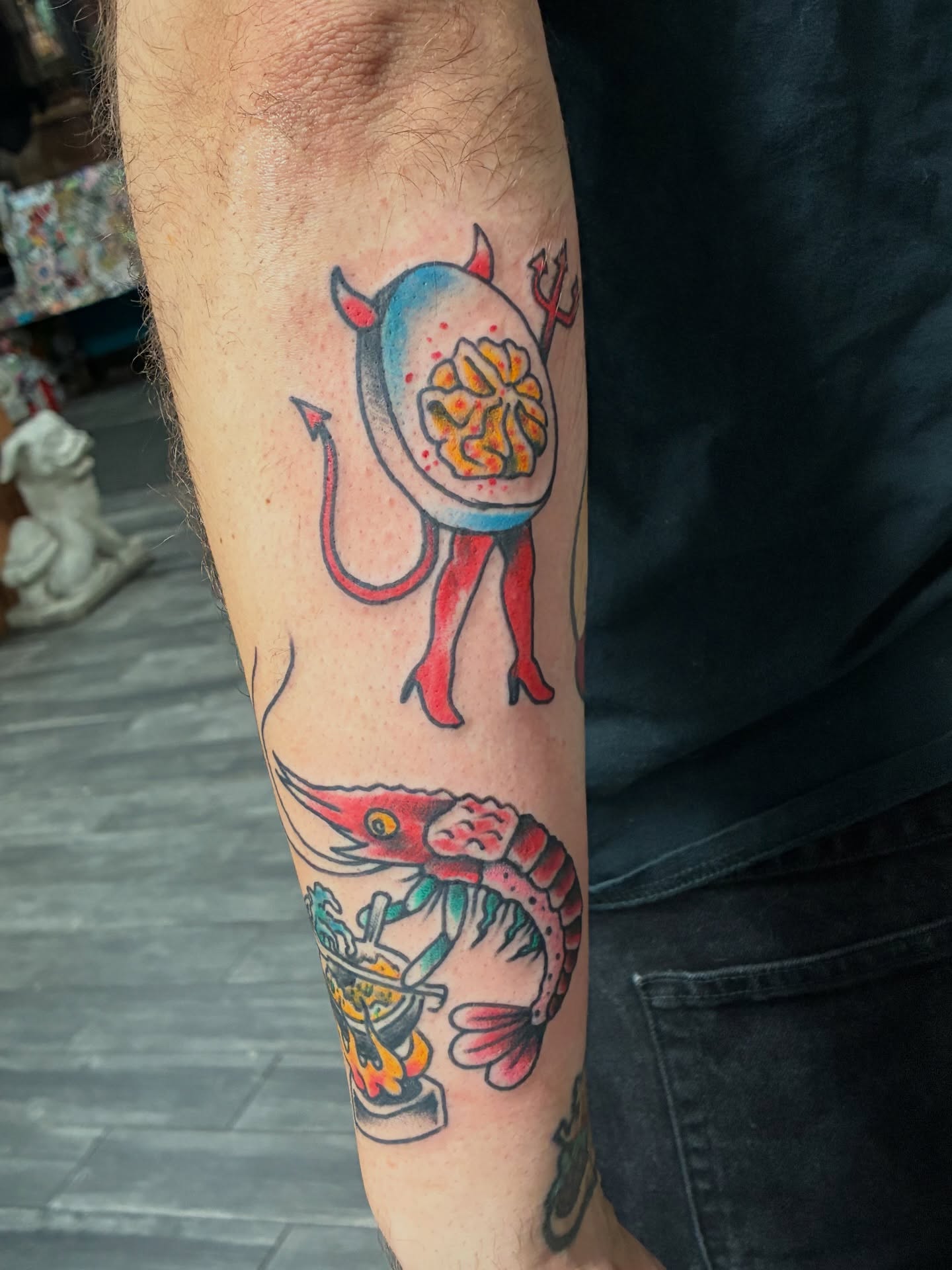 Demon shrimp American traditional tattoo on the forearm by Kennedy Cole