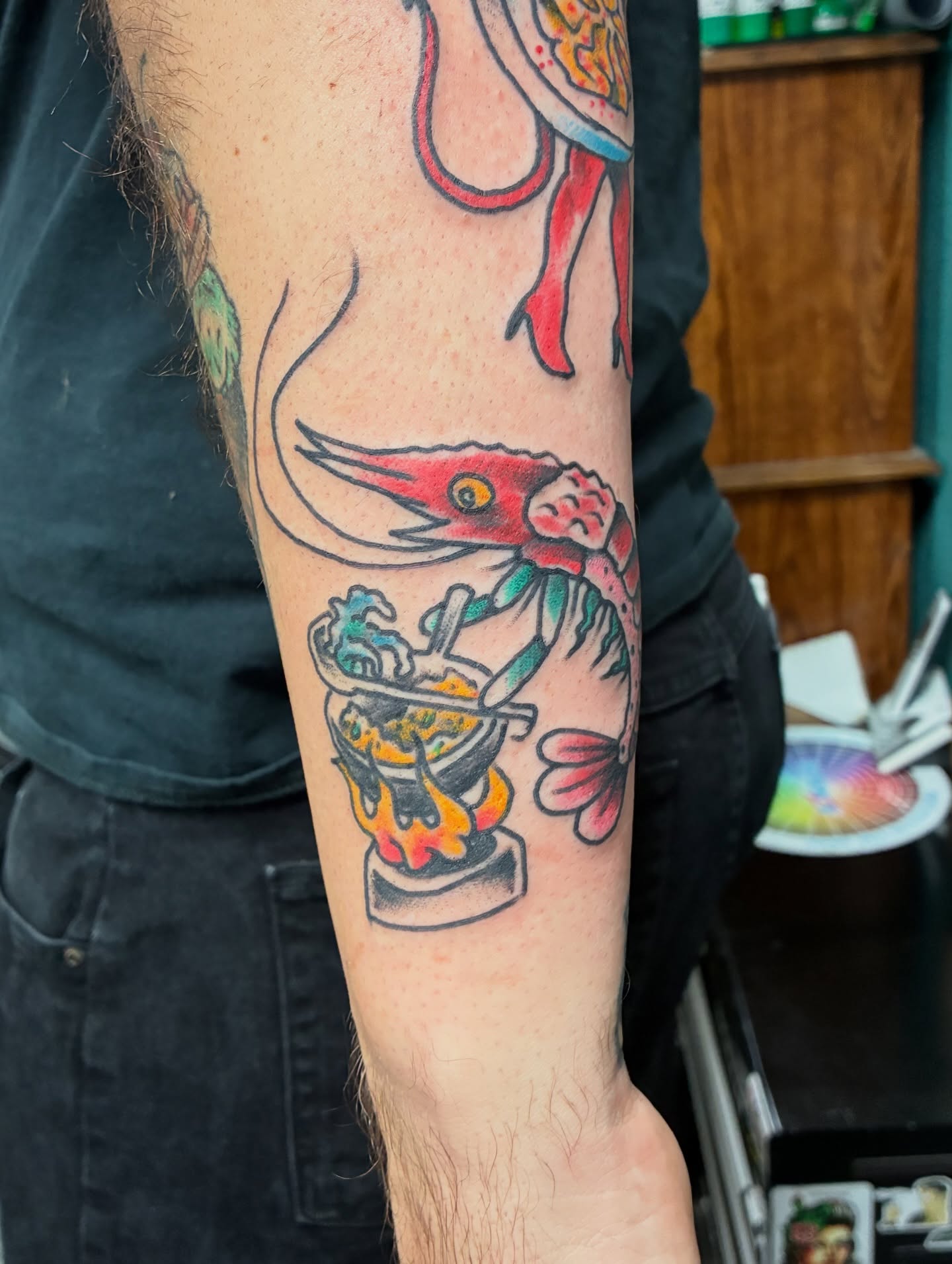 Squid cooking American traditional tattoo on the forearm by Kennedy Cole
