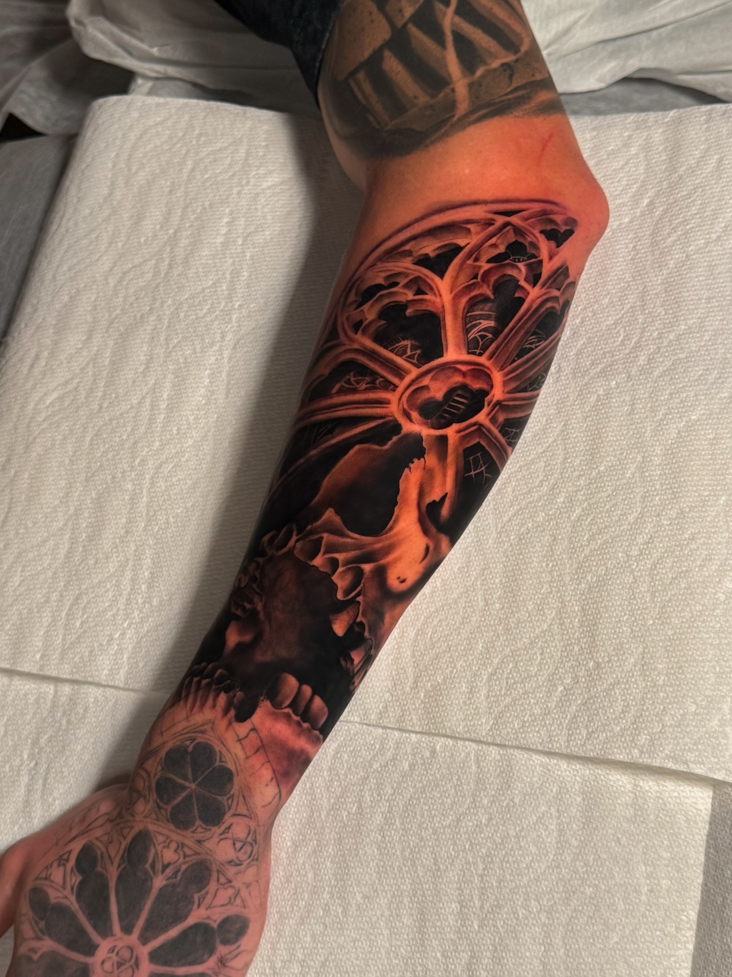 Gothic architecture dark realism tattoo on the forearm by Iryna Polyakhova