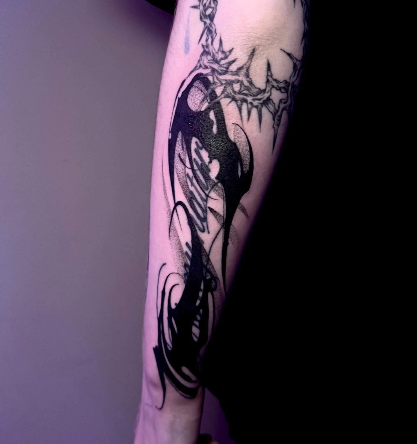 Crow and thorns dotwork tattoo on the forearm by Claire Litsey