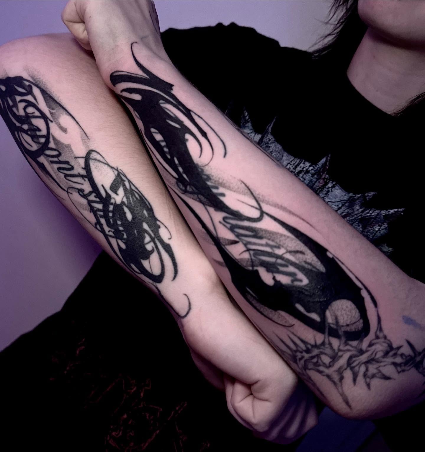 Crow black and grey tattoo on the forearm by Claire Litsey