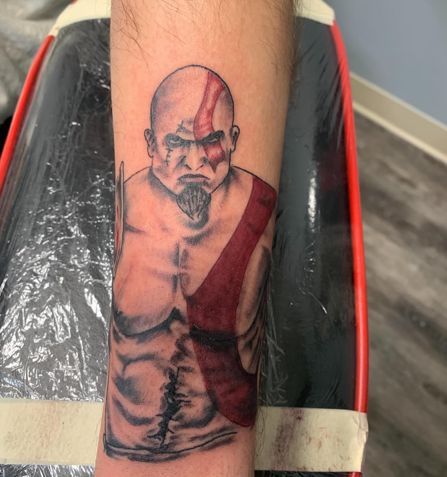 Kratos realism tattoo on the forearm by @goat76