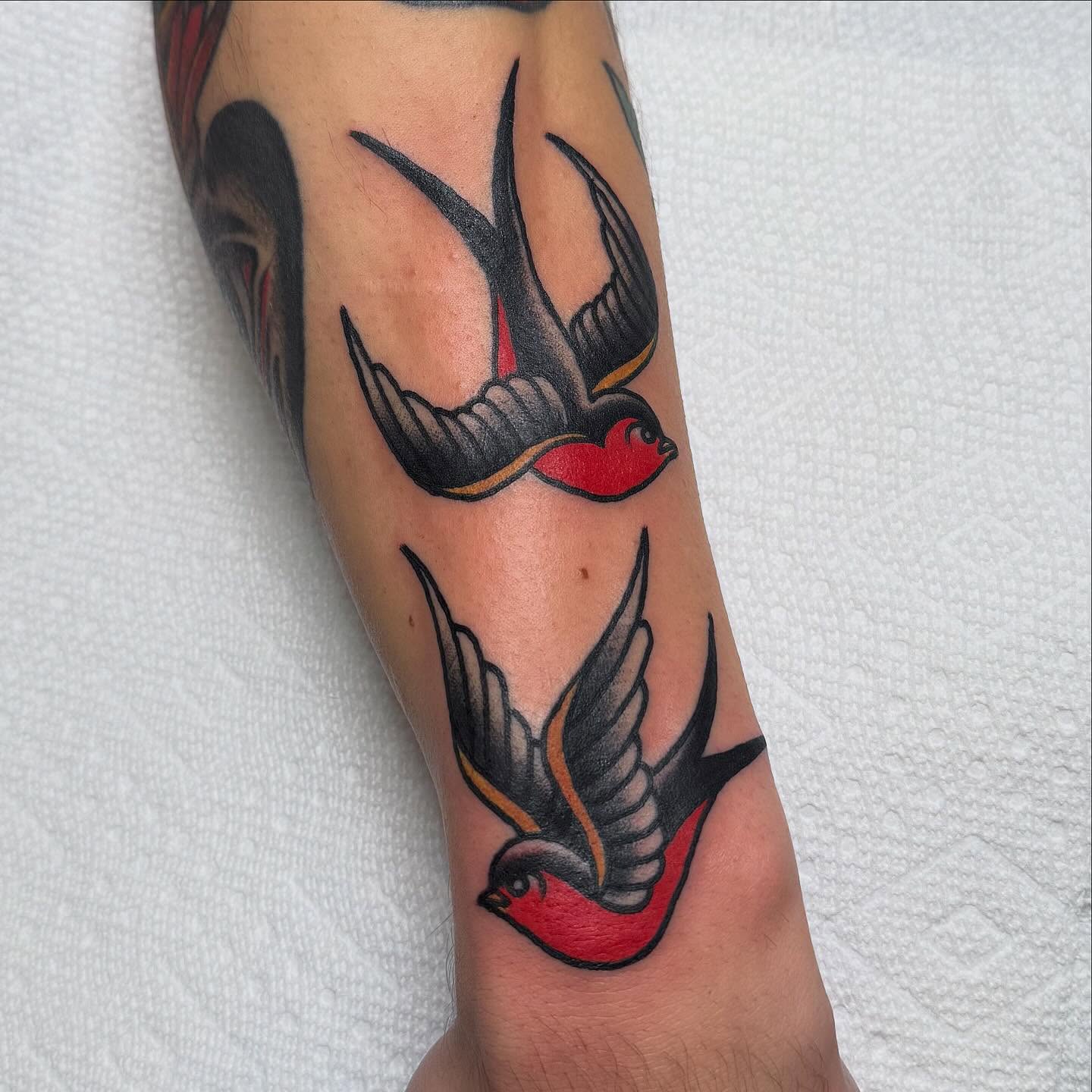 Swallows American traditional tattoo on the forearm by Zach Roman, Madison, Wisconsin