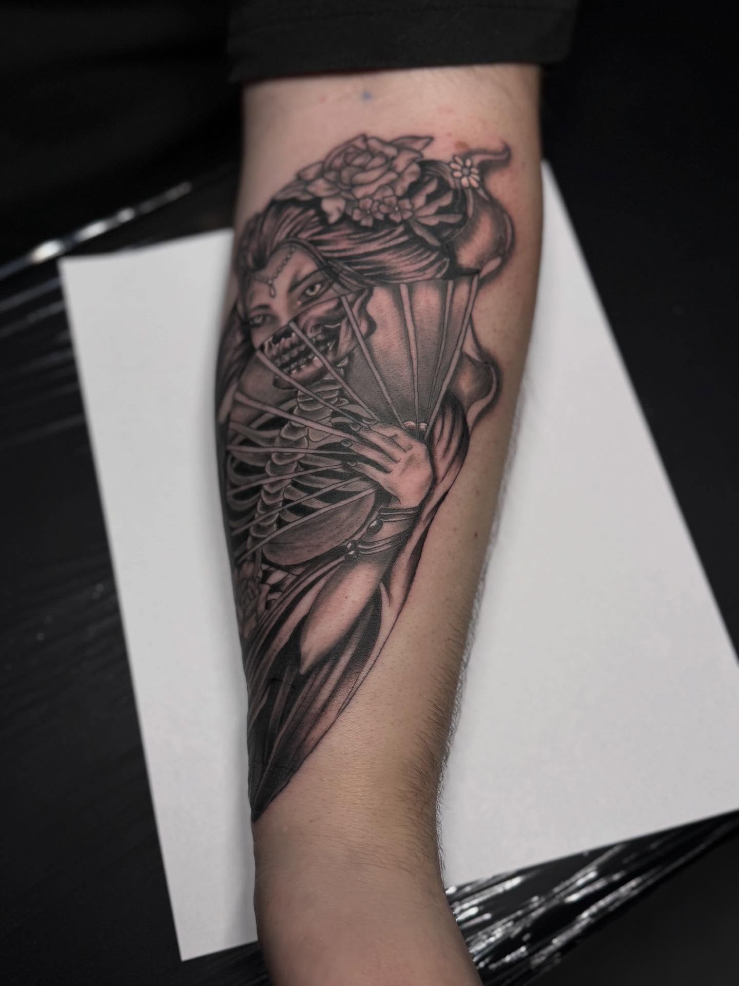 Woman with flowers realism tattoo on the forearm by Jacob - Tattoo Artist
