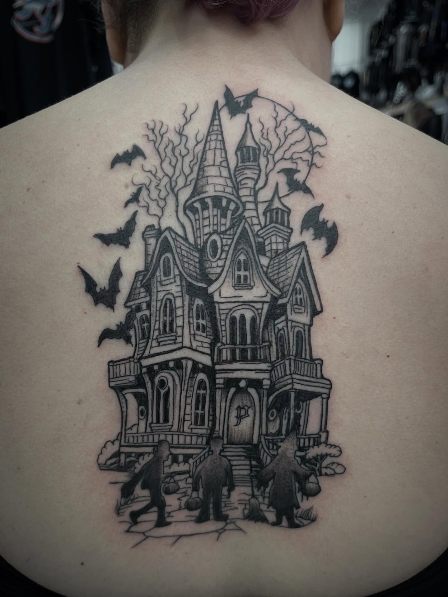 Haunted house realism tattoo on the back by Sean Gallagher
