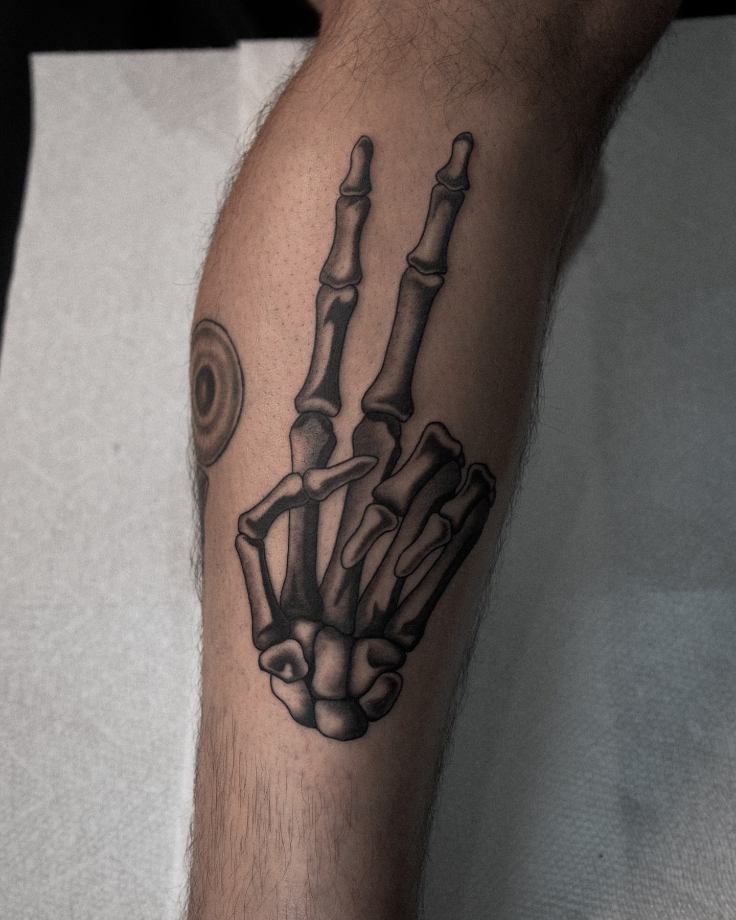 Skeleton hand black and grey tattoo on the forearm by zak brochu, Windsor, Ontario