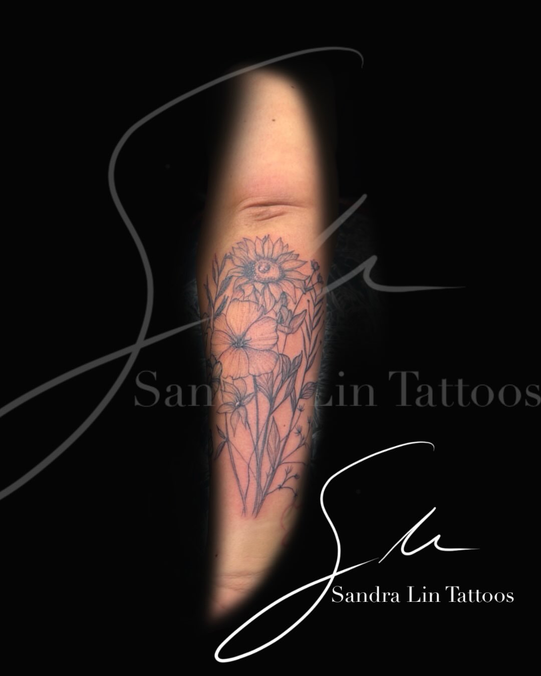Flowers black and grey tattoo on the forearm by Sandra Lin Cue
