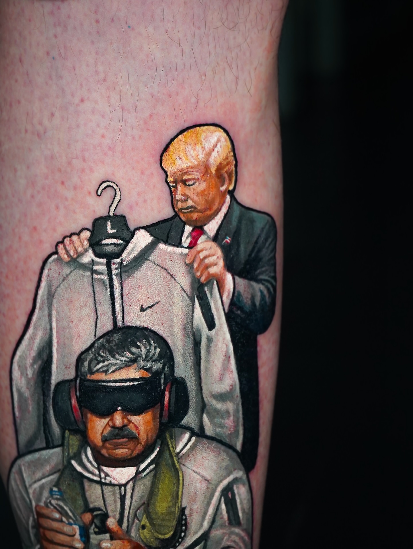 Political satire realism tattoo on the forearm by Luis Gil