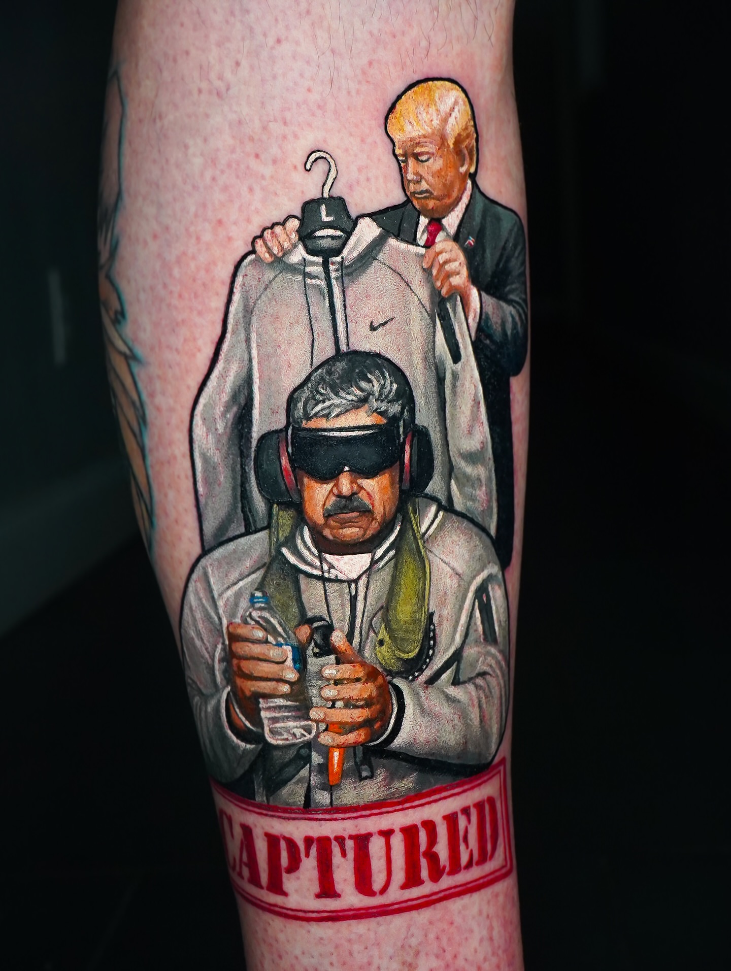 Political satire realism tattoo on the forearm by Luis Gil