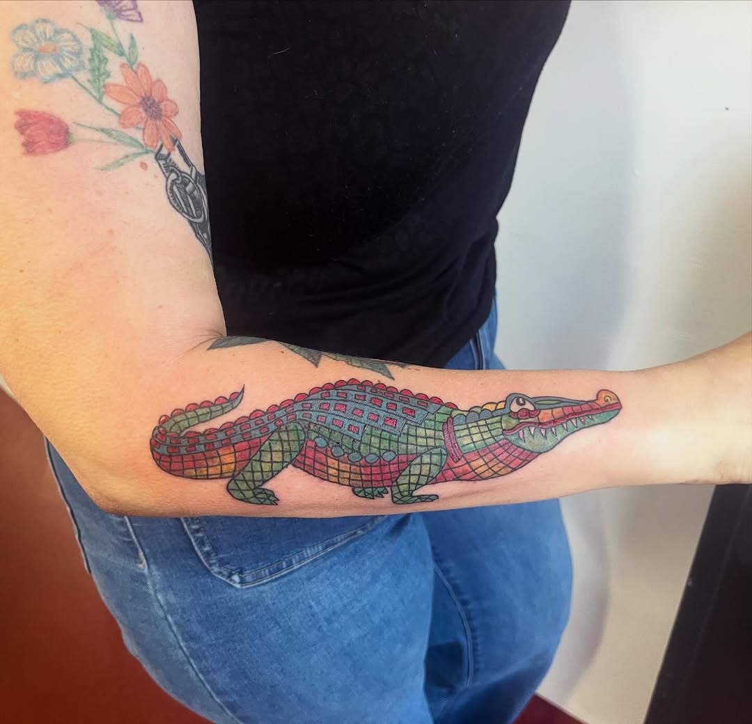 Alligator American traditional tattoo on the forearm by Rafaela Lopez