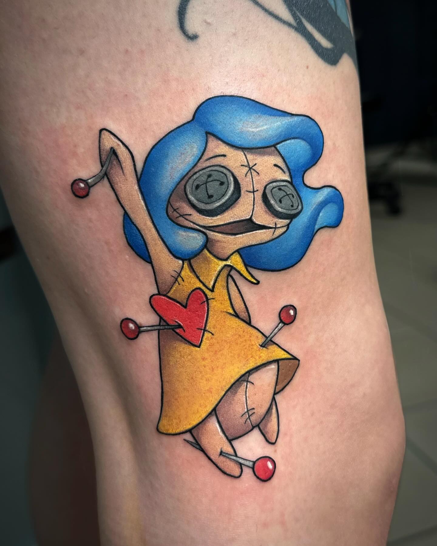 Voodoo doll American traditional tattoo on the thigh by Lena Aleksandrova