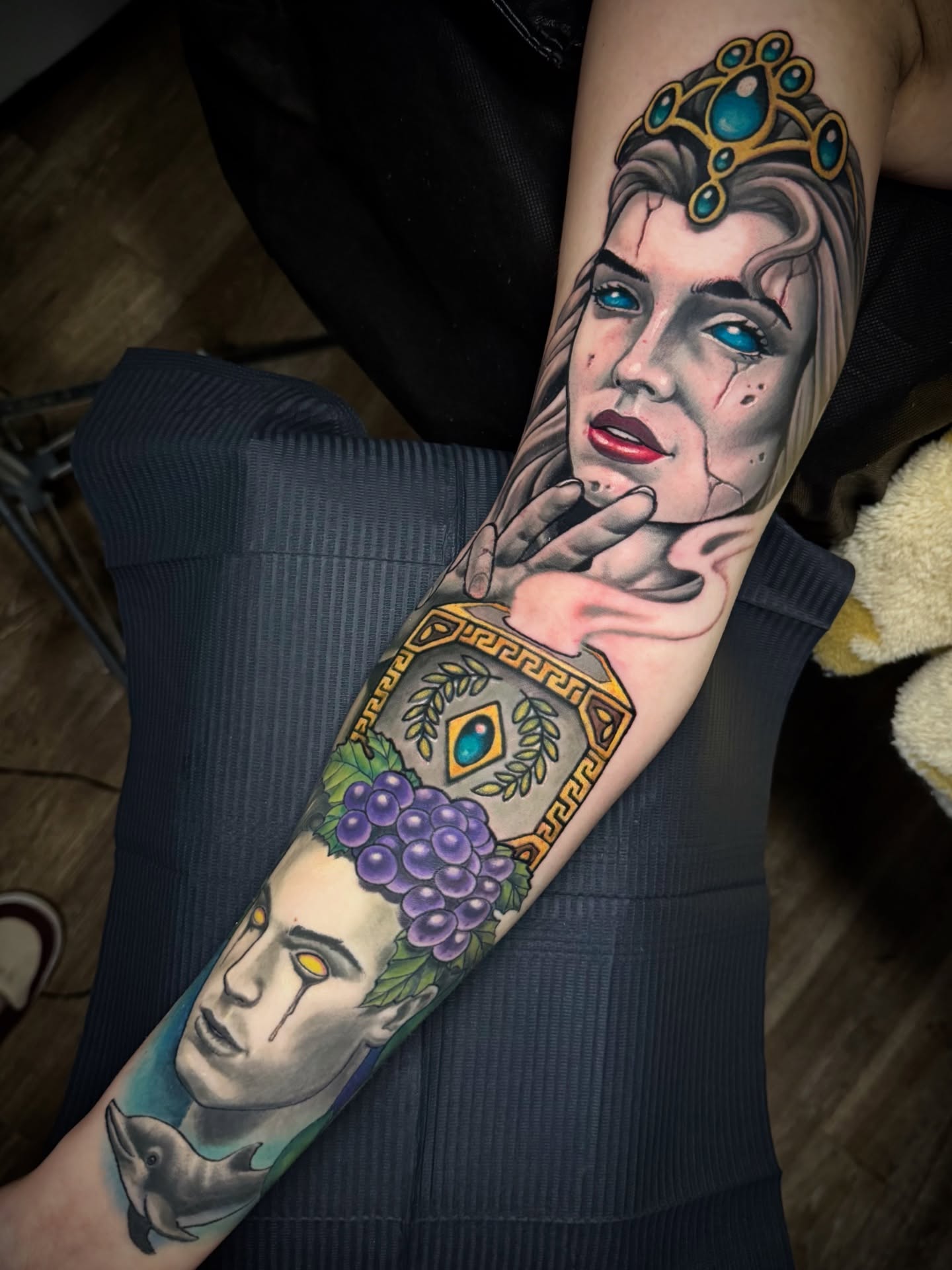 Woman with crown realism tattoo on the forearm by Kevin Boudreau Newschool Tattoos