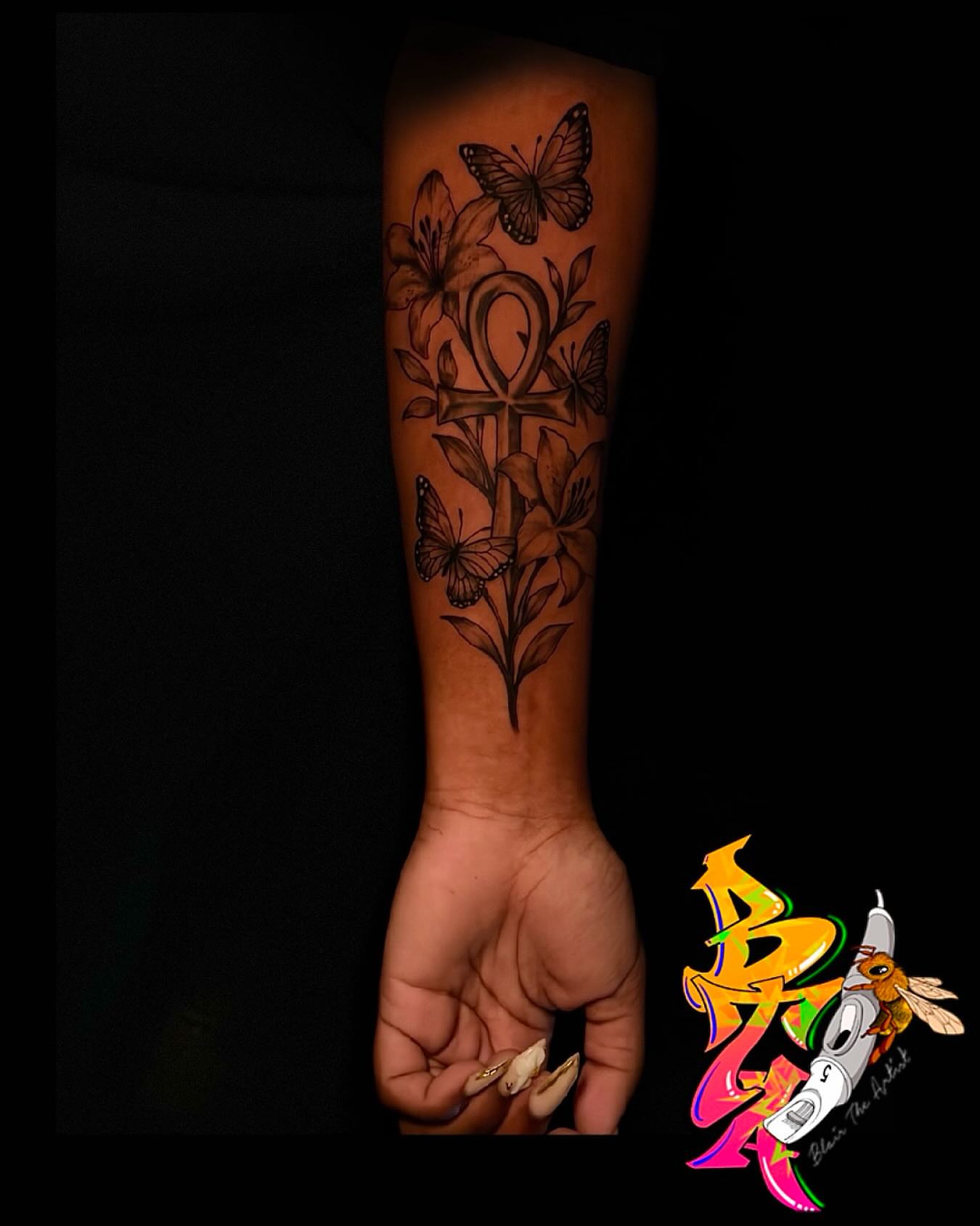 Cross with flowers and butterflies black and grey tattoo on the forearm by Blair The Artist!