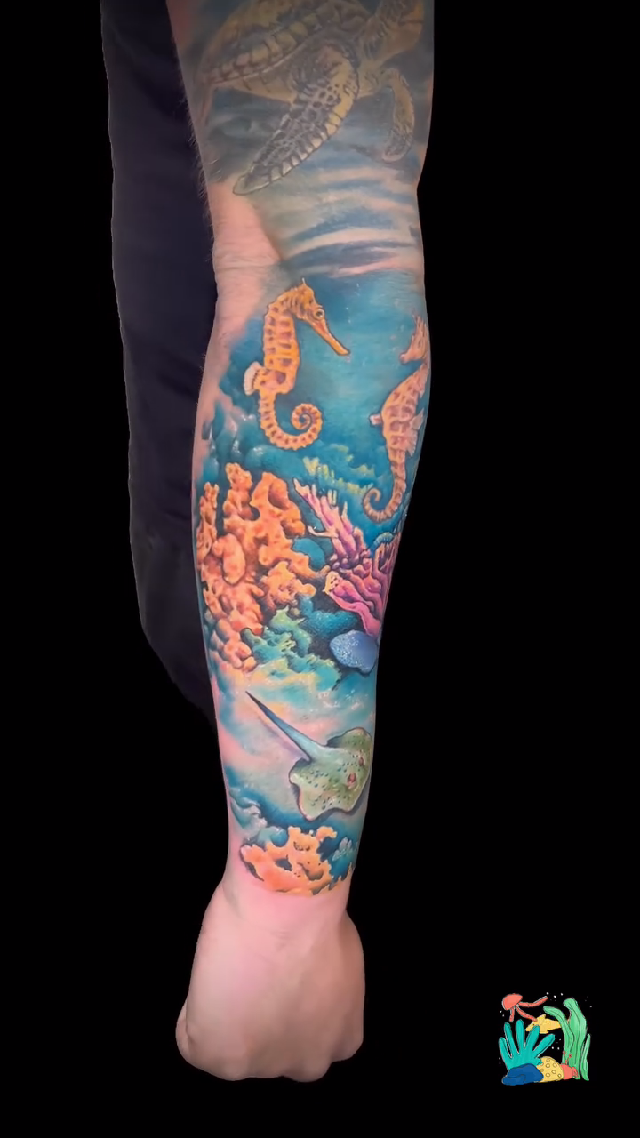 Underwater scene with seahorses and coral realism tattoo by Daniel Fisher, Berlin, New Jersey