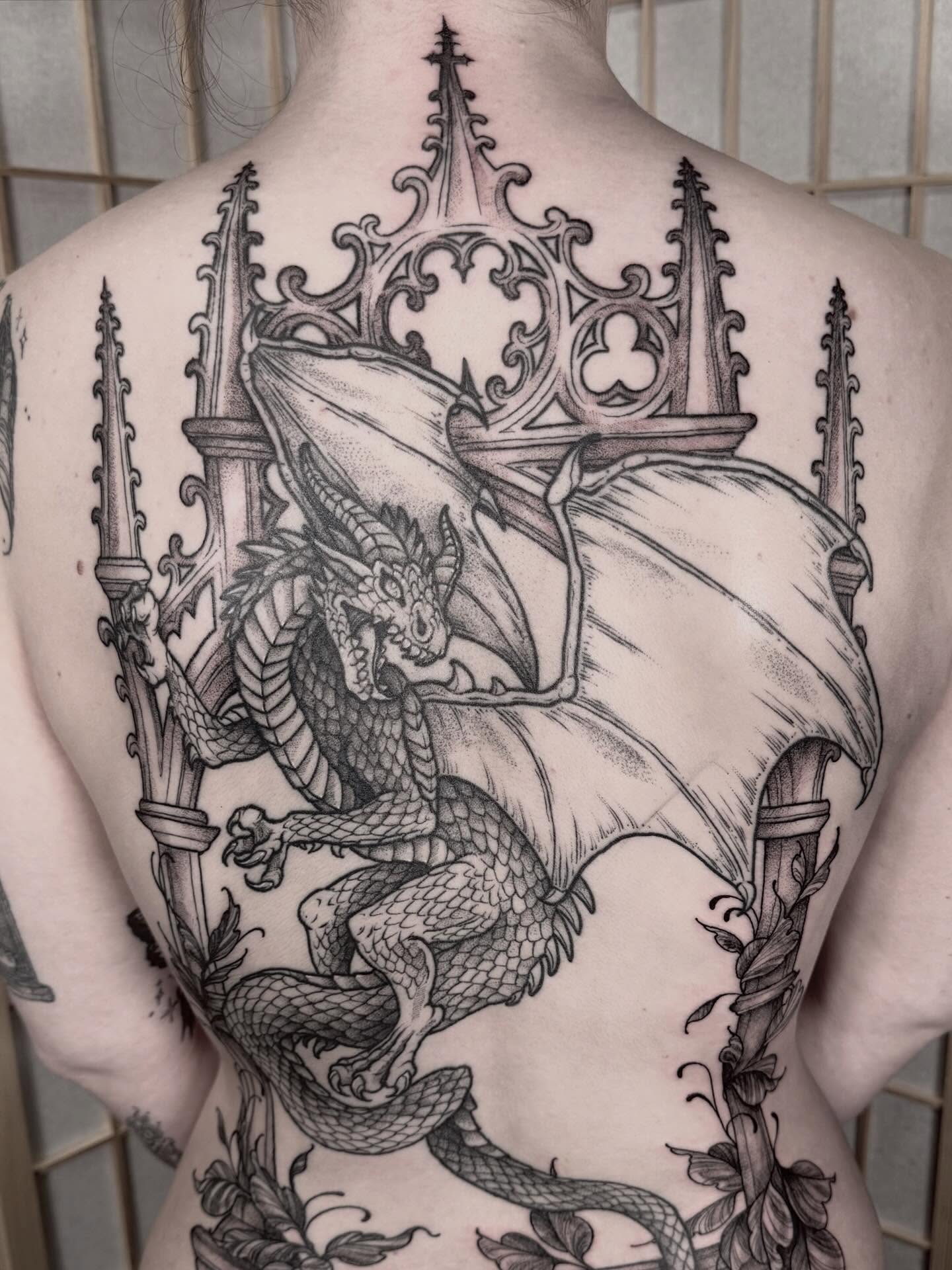 Dragon and cathedral realism tattoo on the back by Cincinnati