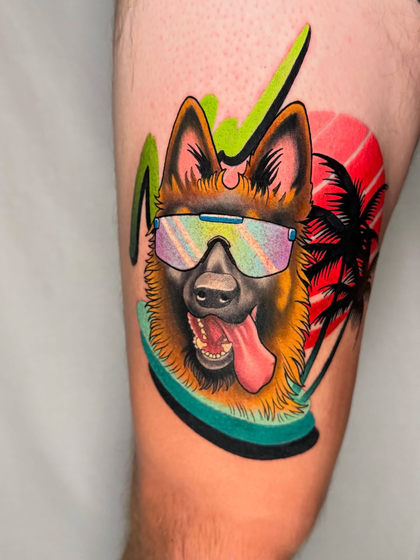 German shepherd wearing sunglasses new school tattoo on the thigh by Pat Patterson Florida Tattoo Artist