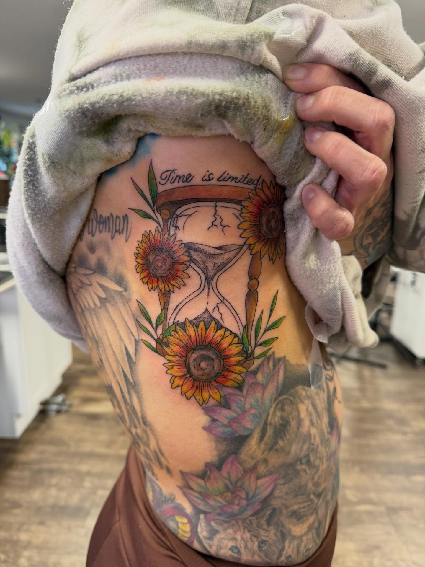 Hourglass and sunflowers American traditional tattoo on the torso by Hope Powell, Vancouver, Washington