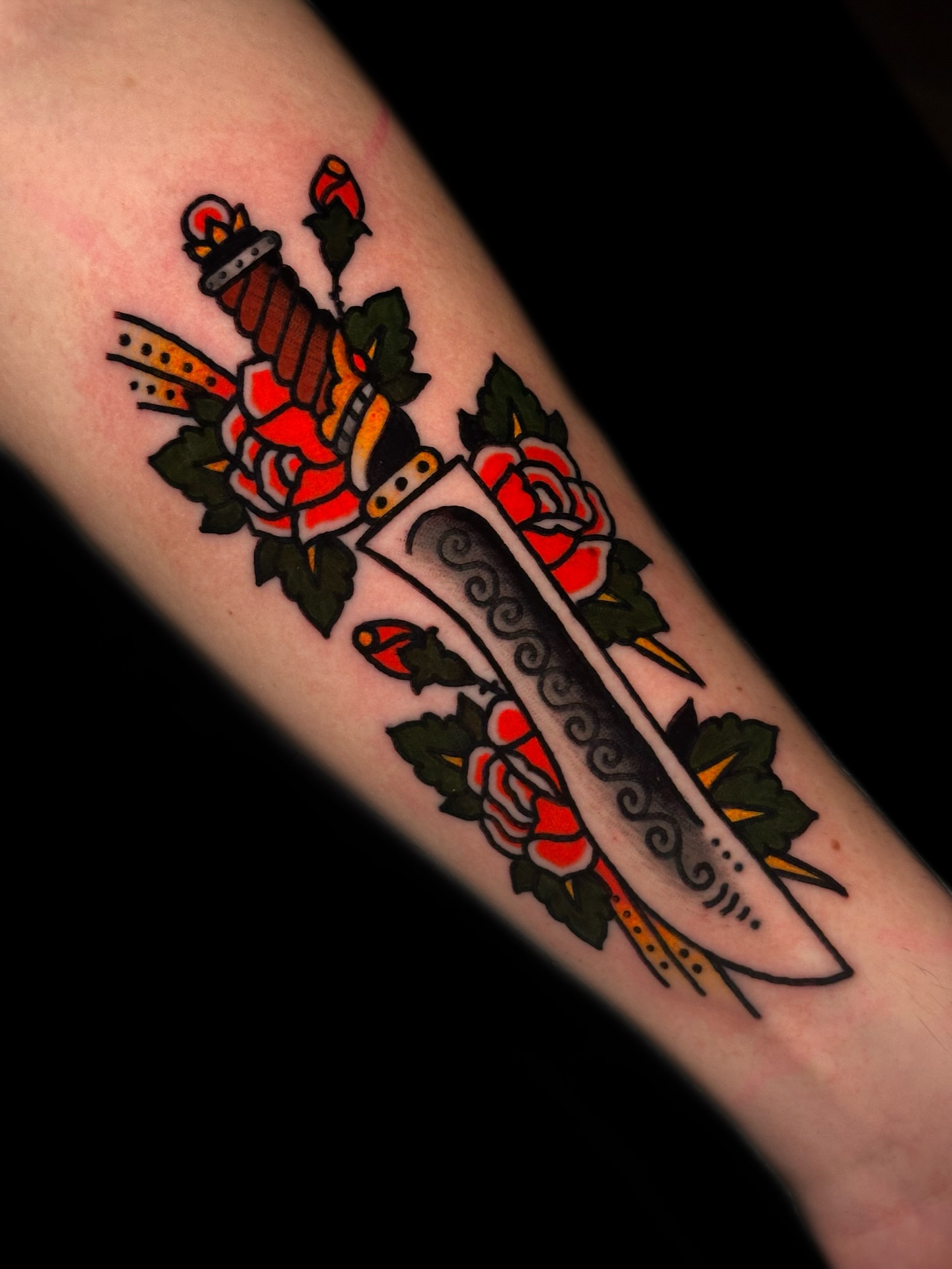 Sword and roses American traditional tattoo on the forearm by Danny Reis