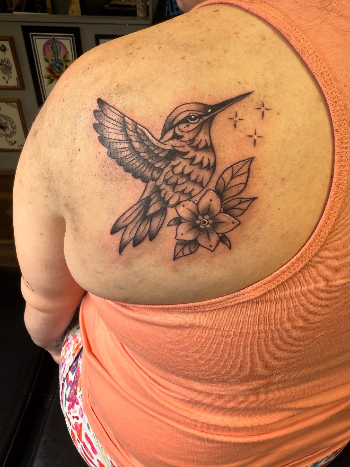 Hummingbird and flowers black and grey tattoo on the shoulder by Palmer Andrist🩸Fort Collins Tattoo Apprentice