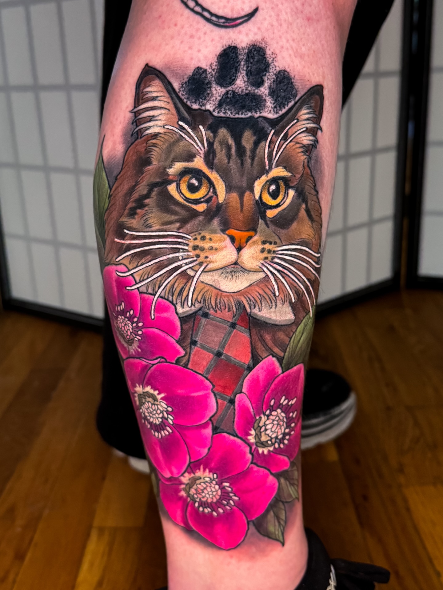 Cat and flowers realism tattoo on the forearm by Austin Britt